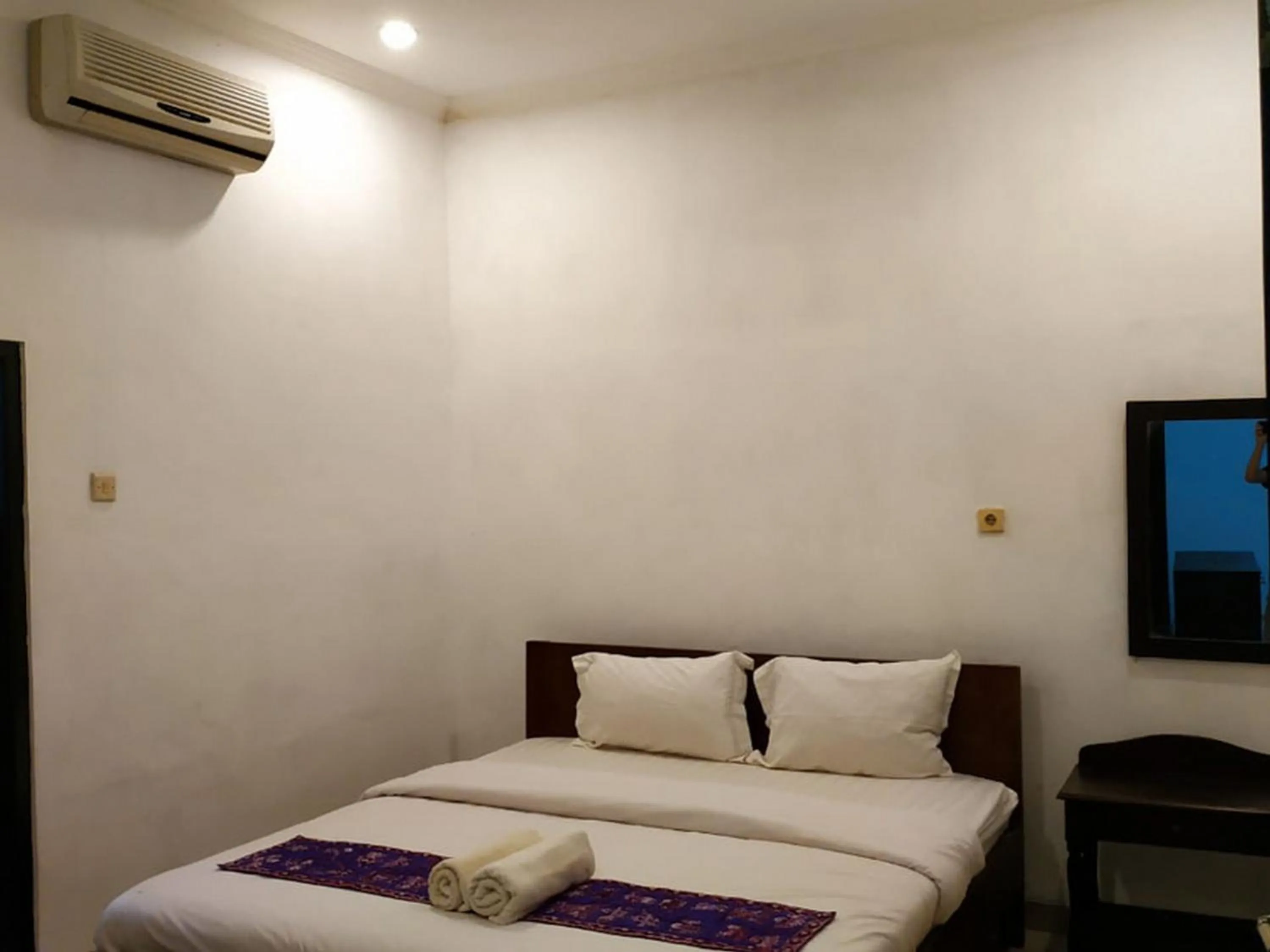 Bed in Alam Jogja Resort Mitra RedDoorz