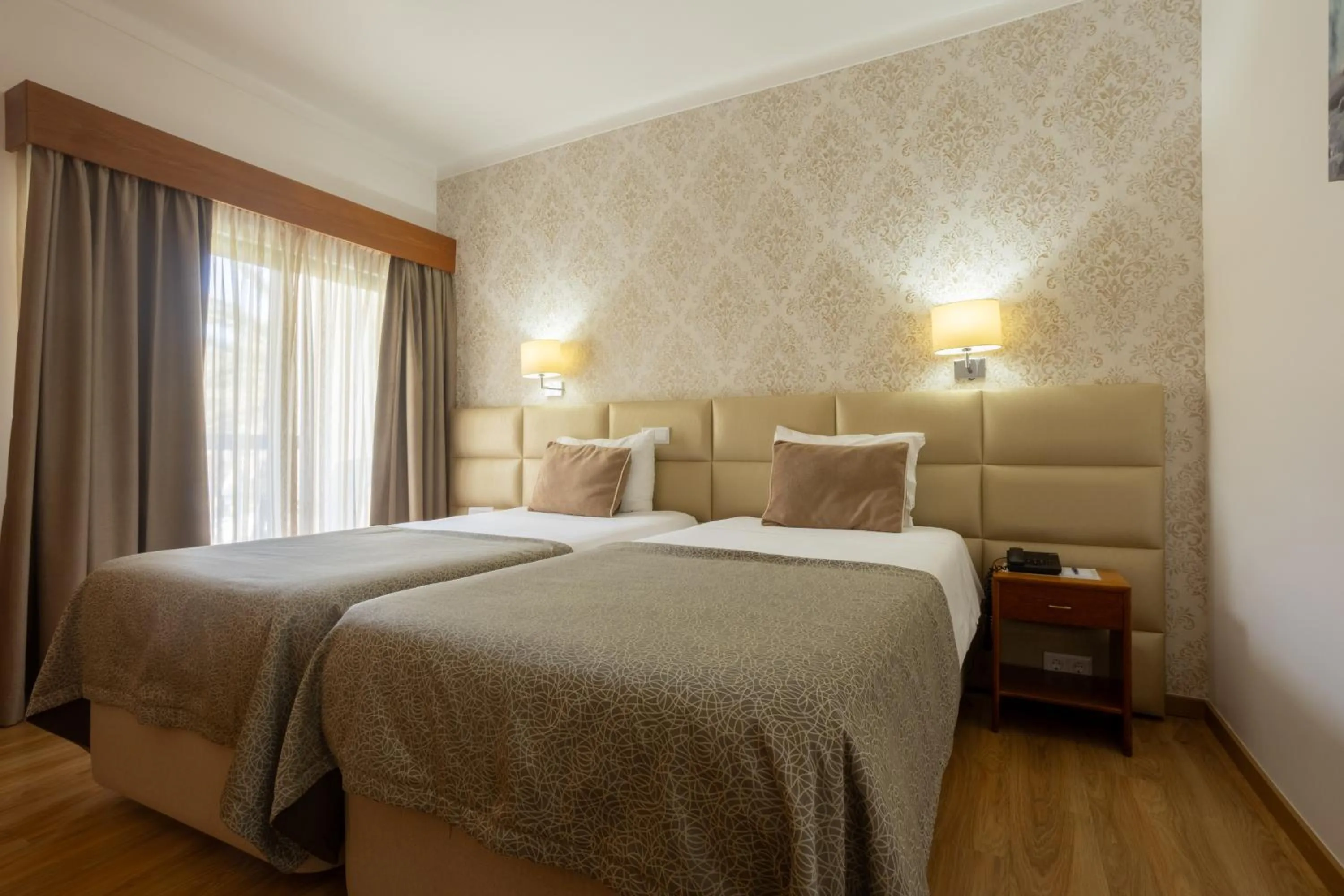 Bed in Hotel Sao Jorge Garden