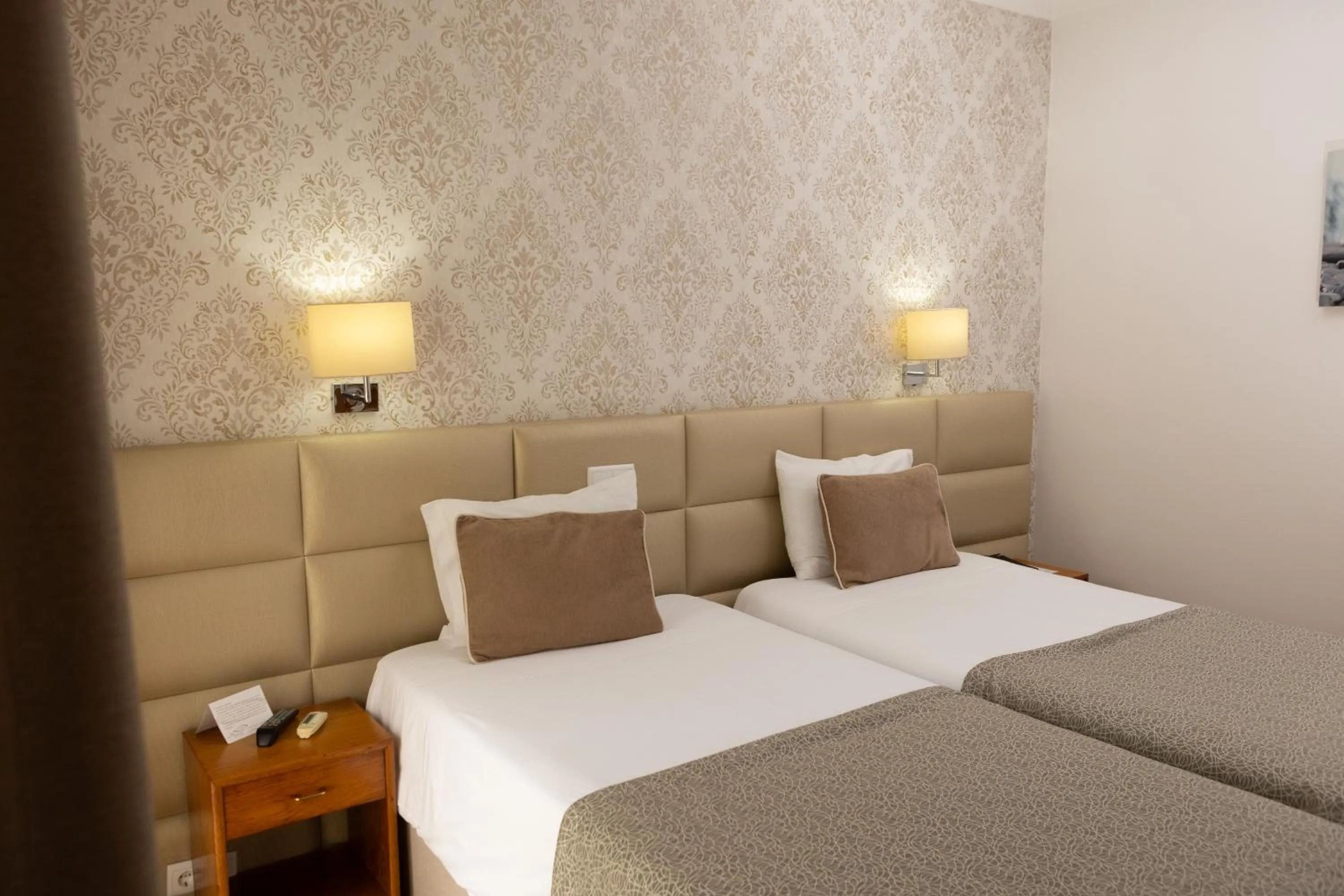 Bed in Hotel Sao Jorge Garden