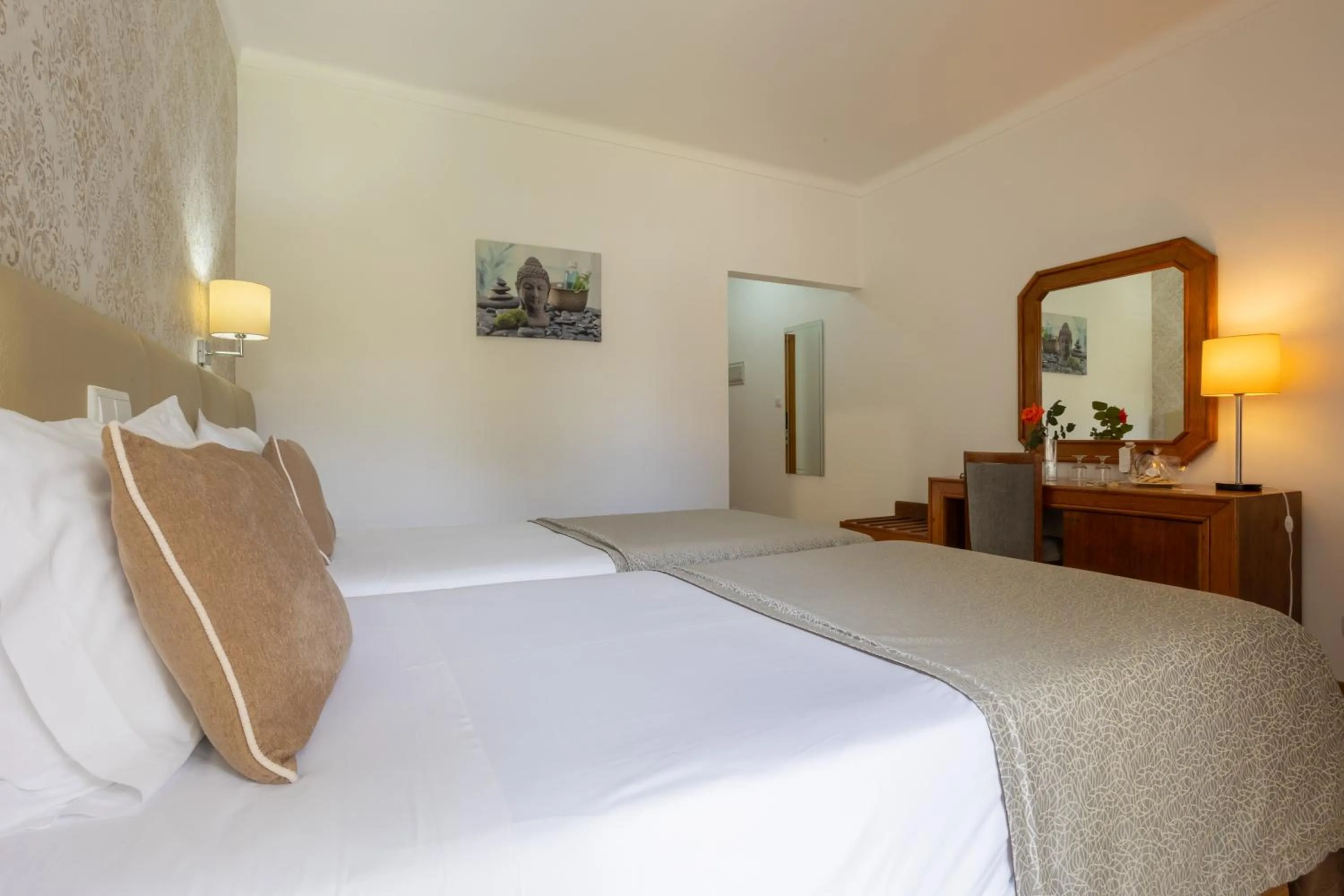 Bed in Hotel Sao Jorge Garden