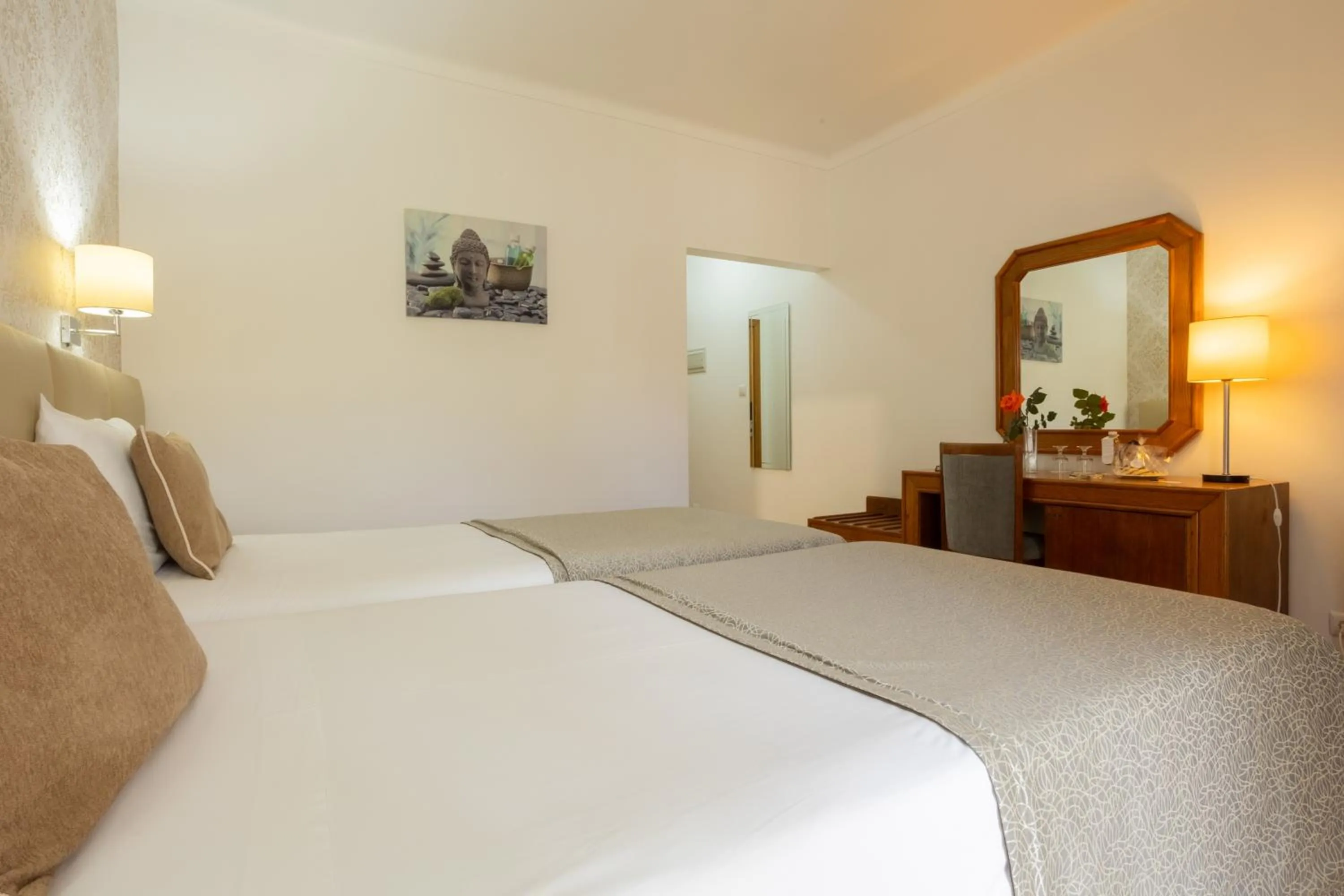 Bed in Hotel Sao Jorge Garden