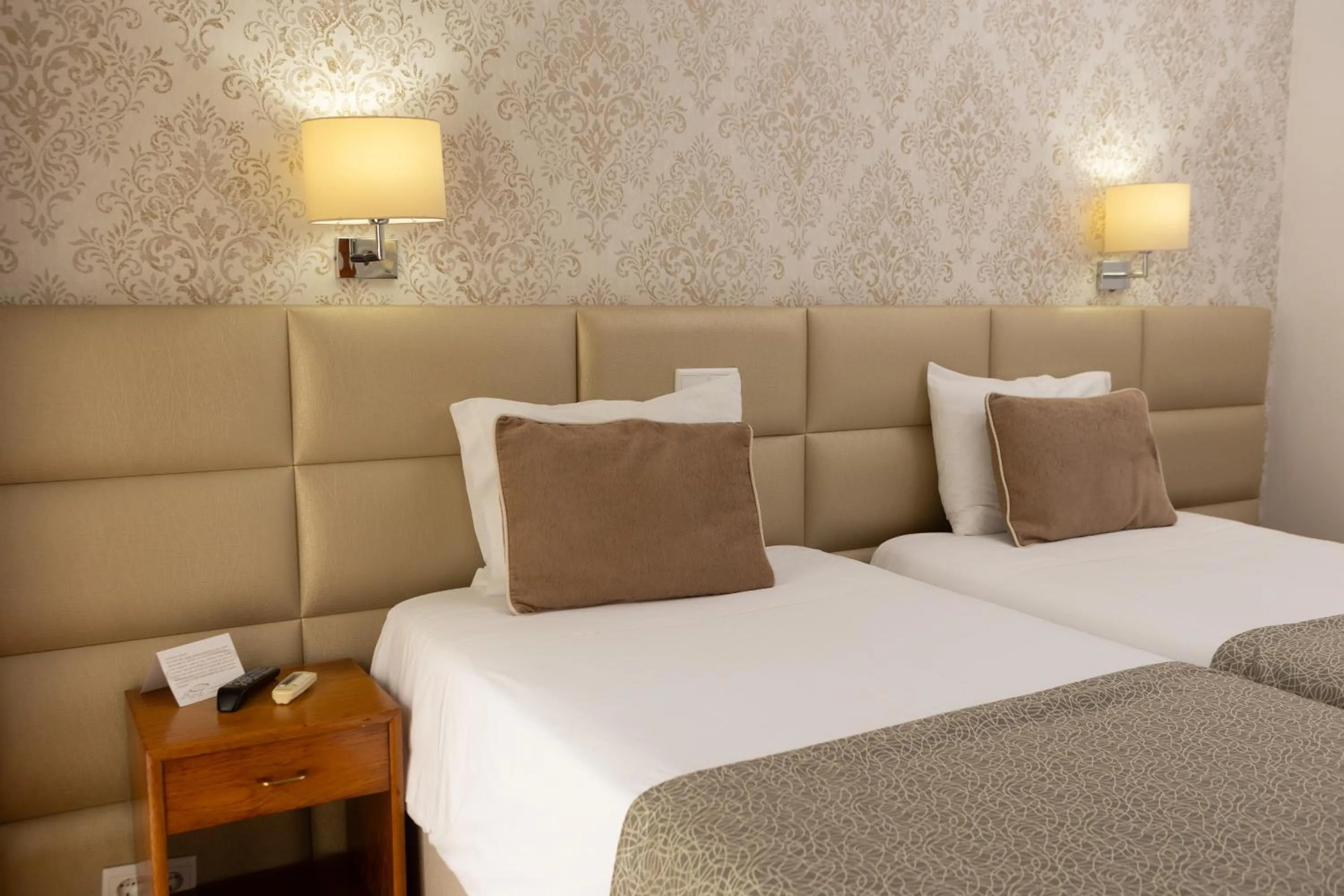 Bed in Hotel Sao Jorge Garden