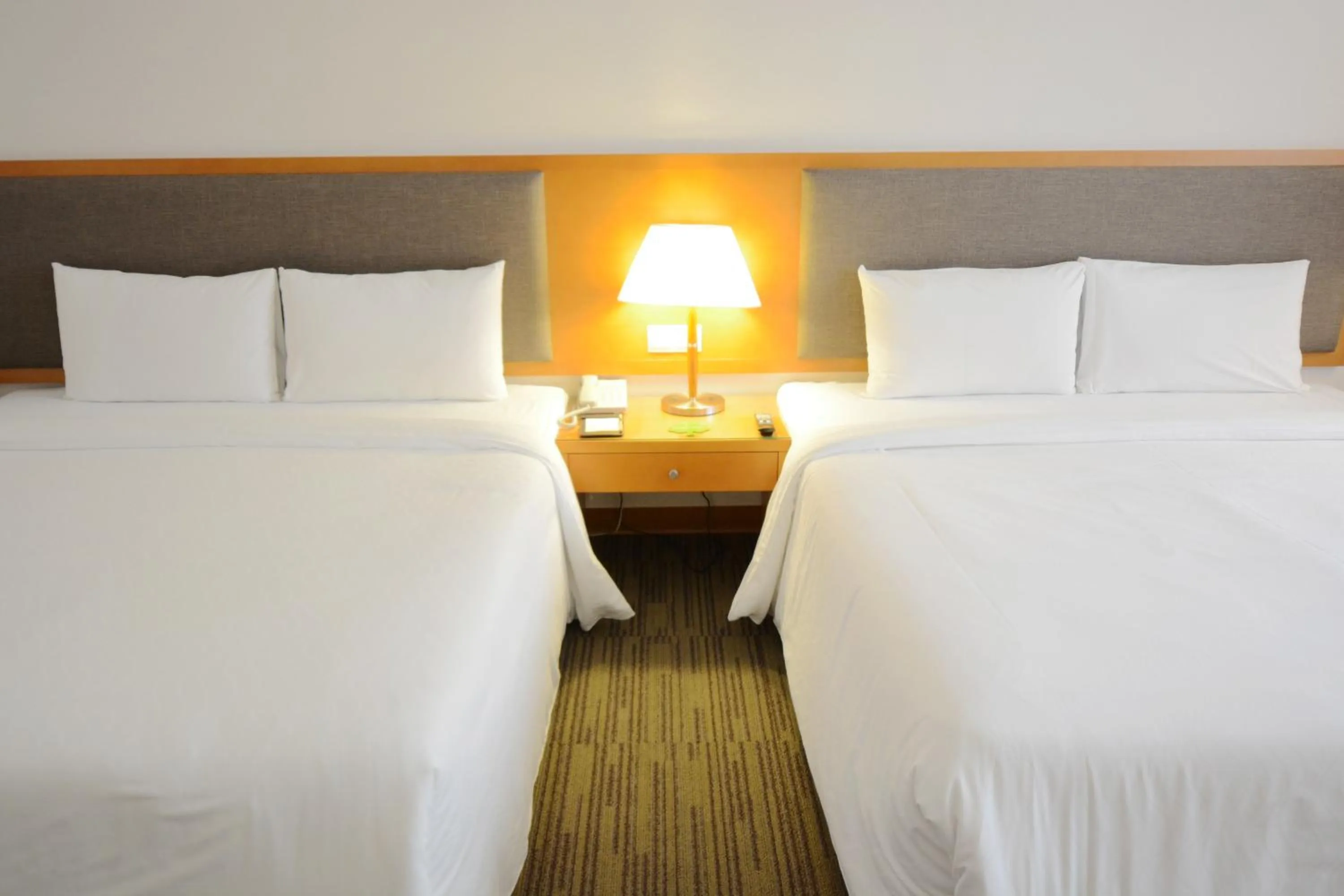 Bed in Fushin Hotel Taichung