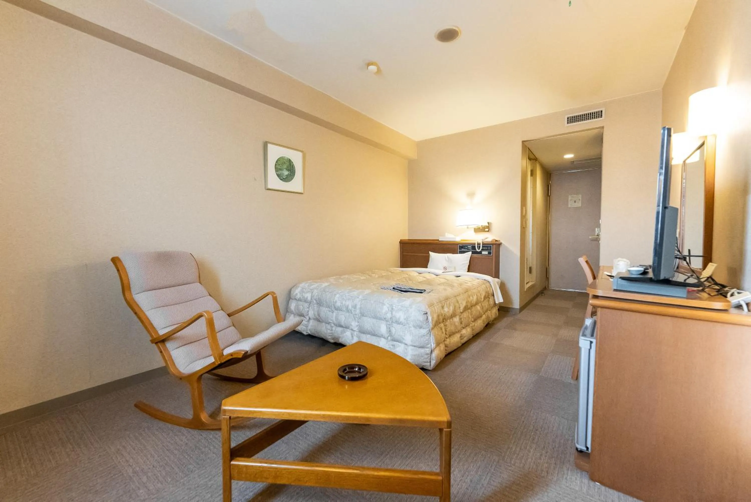 Bed in Tendo Central Hotel