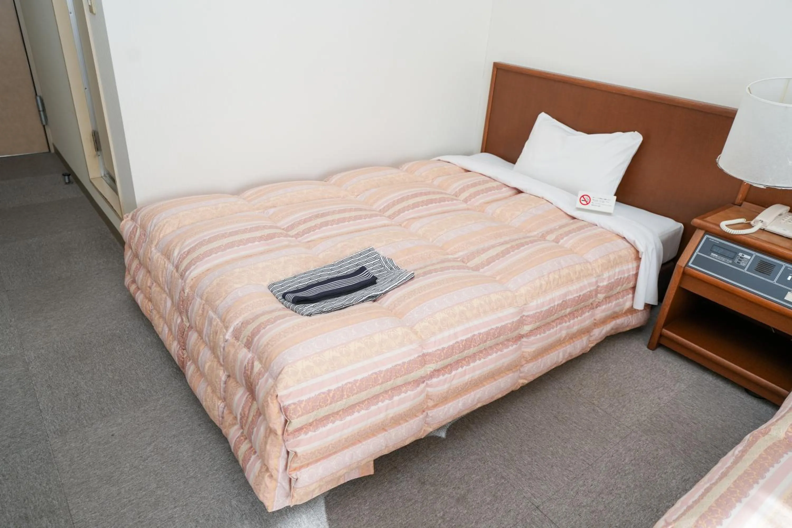 Bed in Tendo Central Hotel