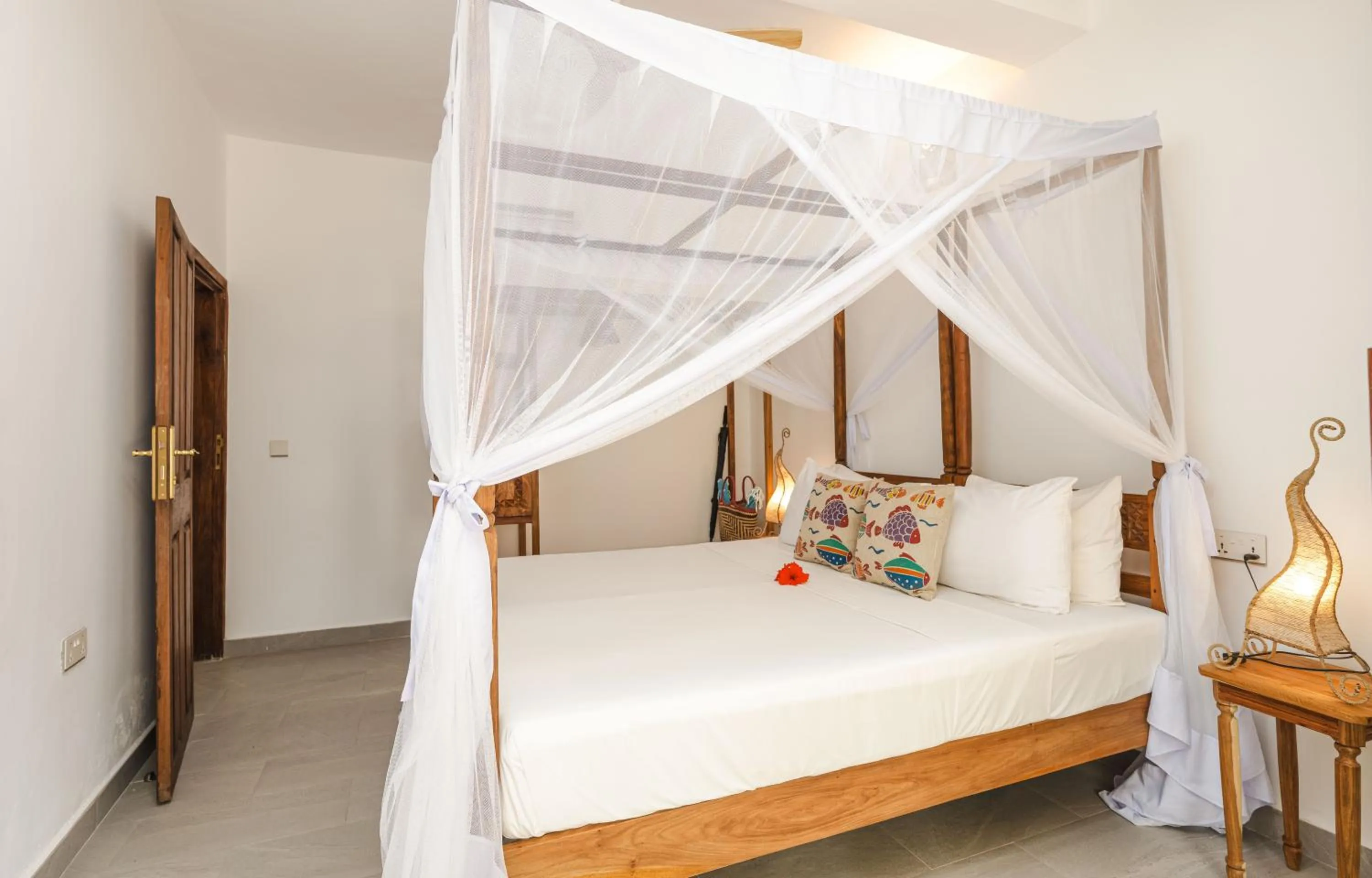 Bed in Mvuvi Boutique Resort