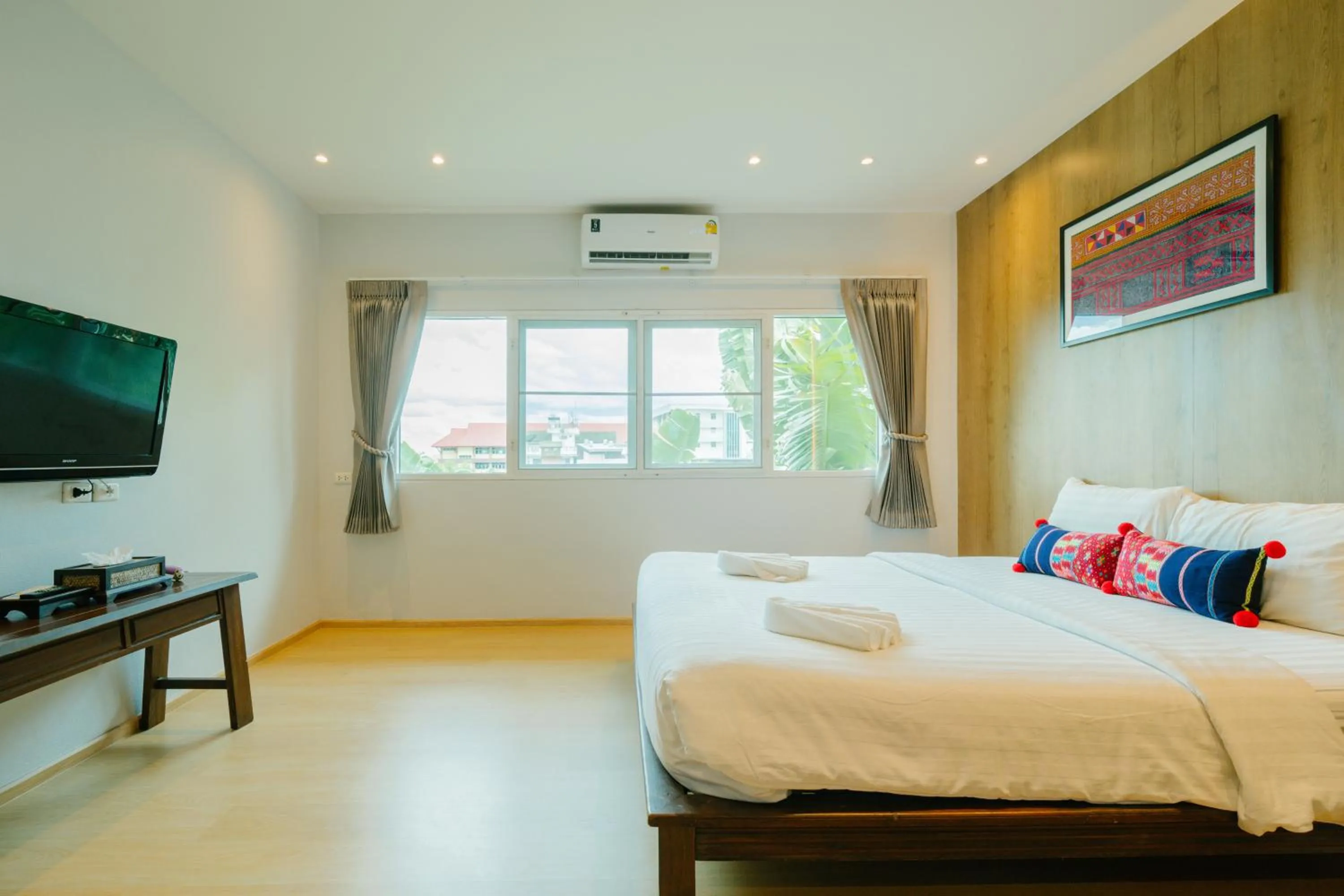 Photo of the whole room, Bed in The Opium Chiang Mai