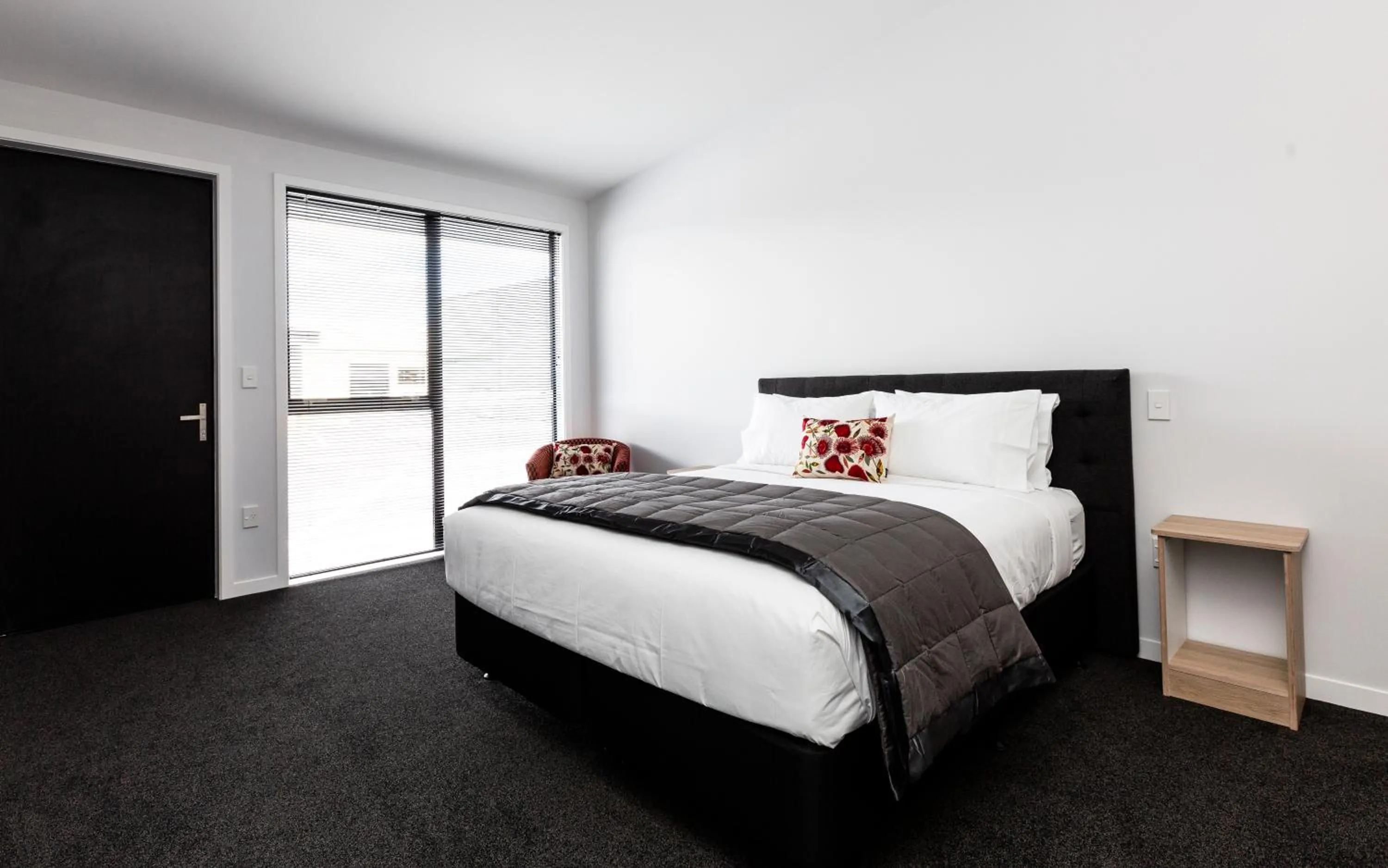 Bed in Zachary's Motel