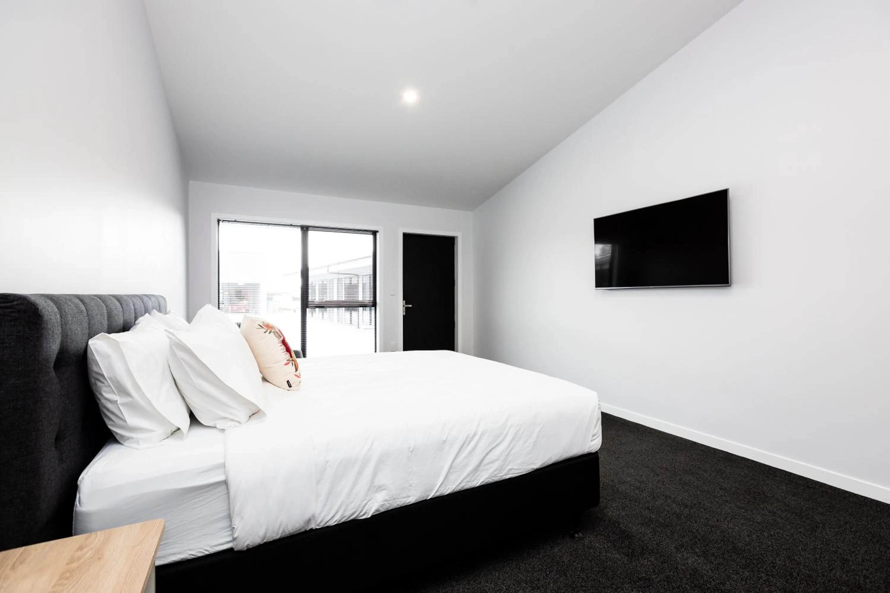 Bed in Zachary's Motel