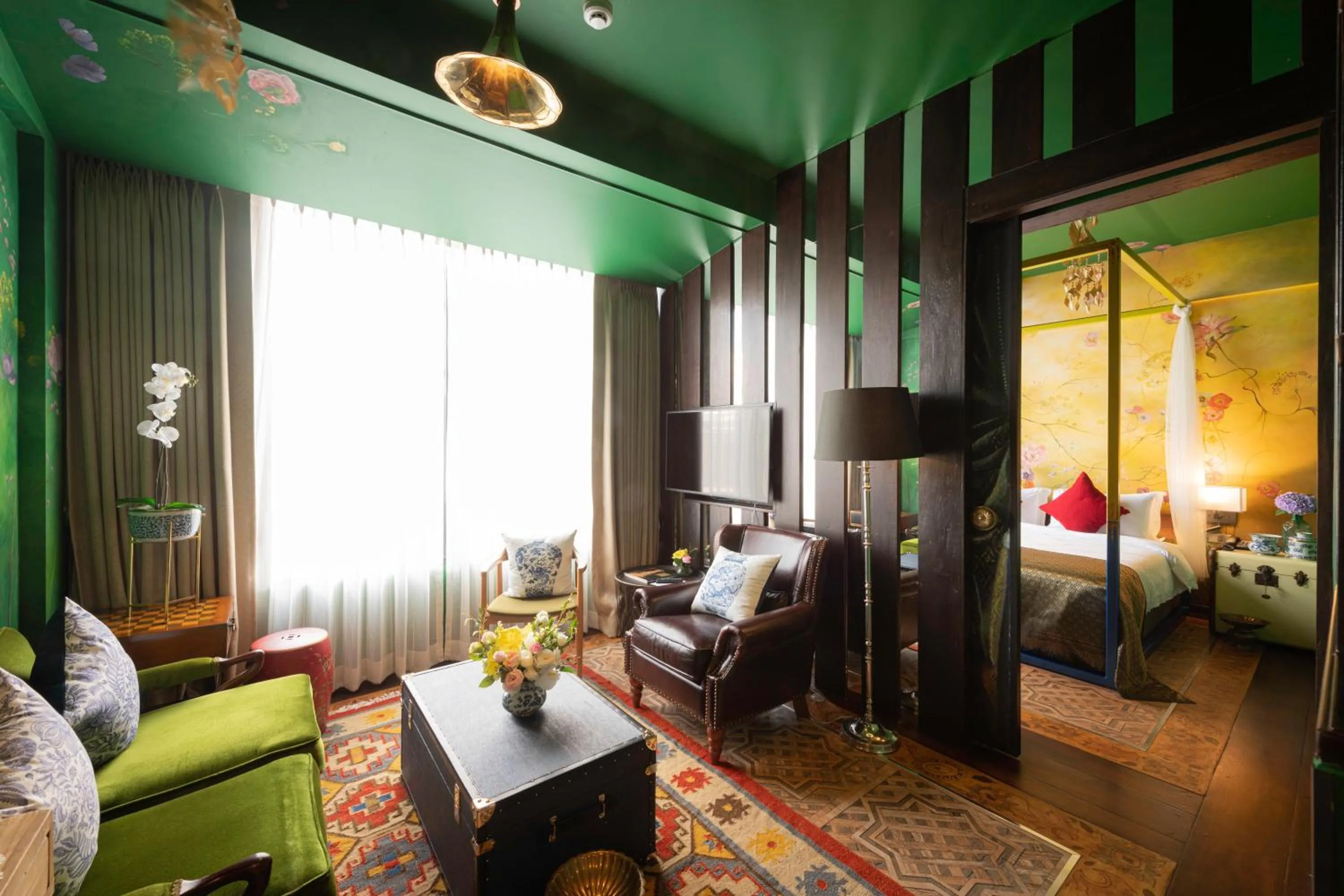 Living room, Bed in Dhevi Bangkok Hotel