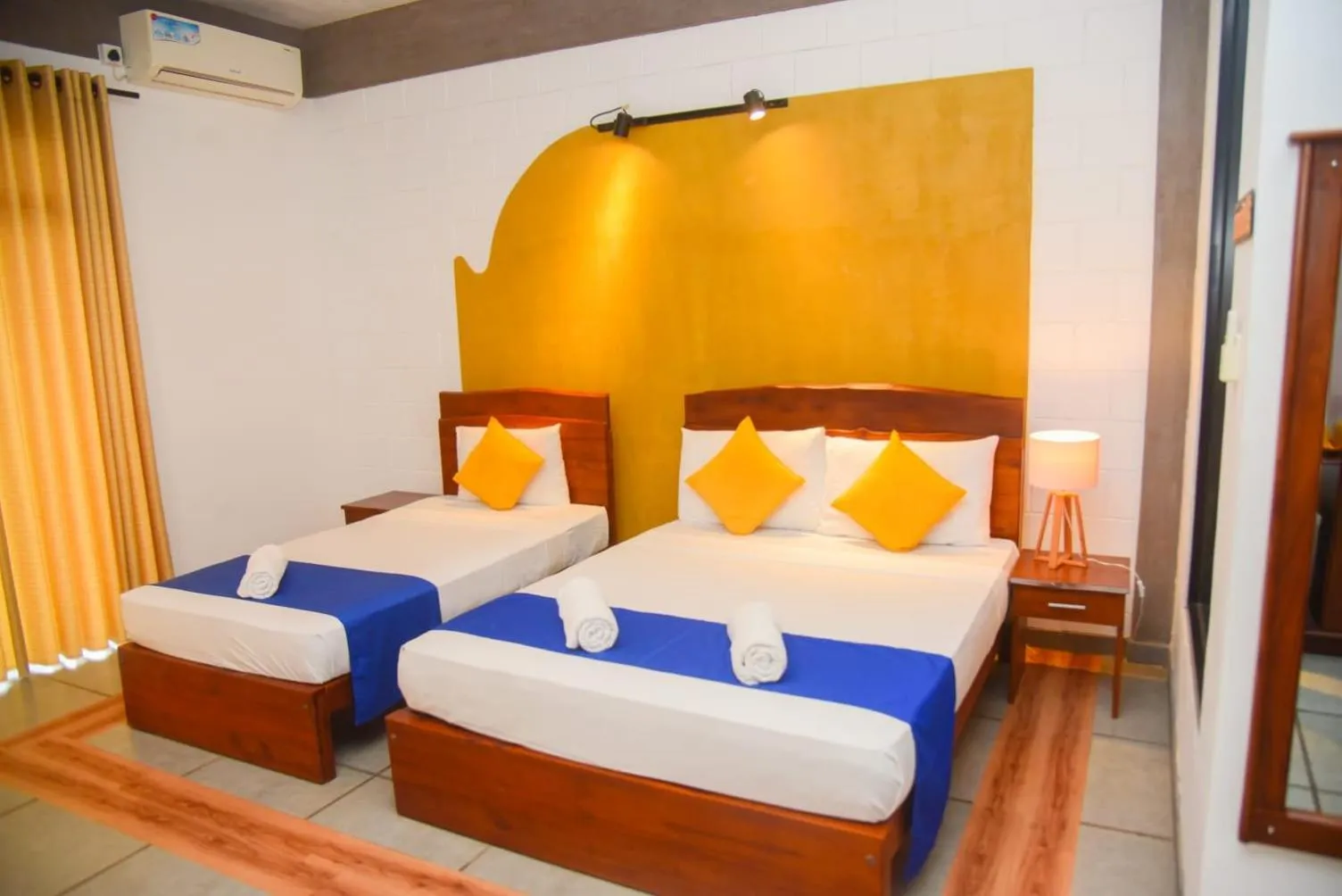 Bed in Royal Tusker Hotel