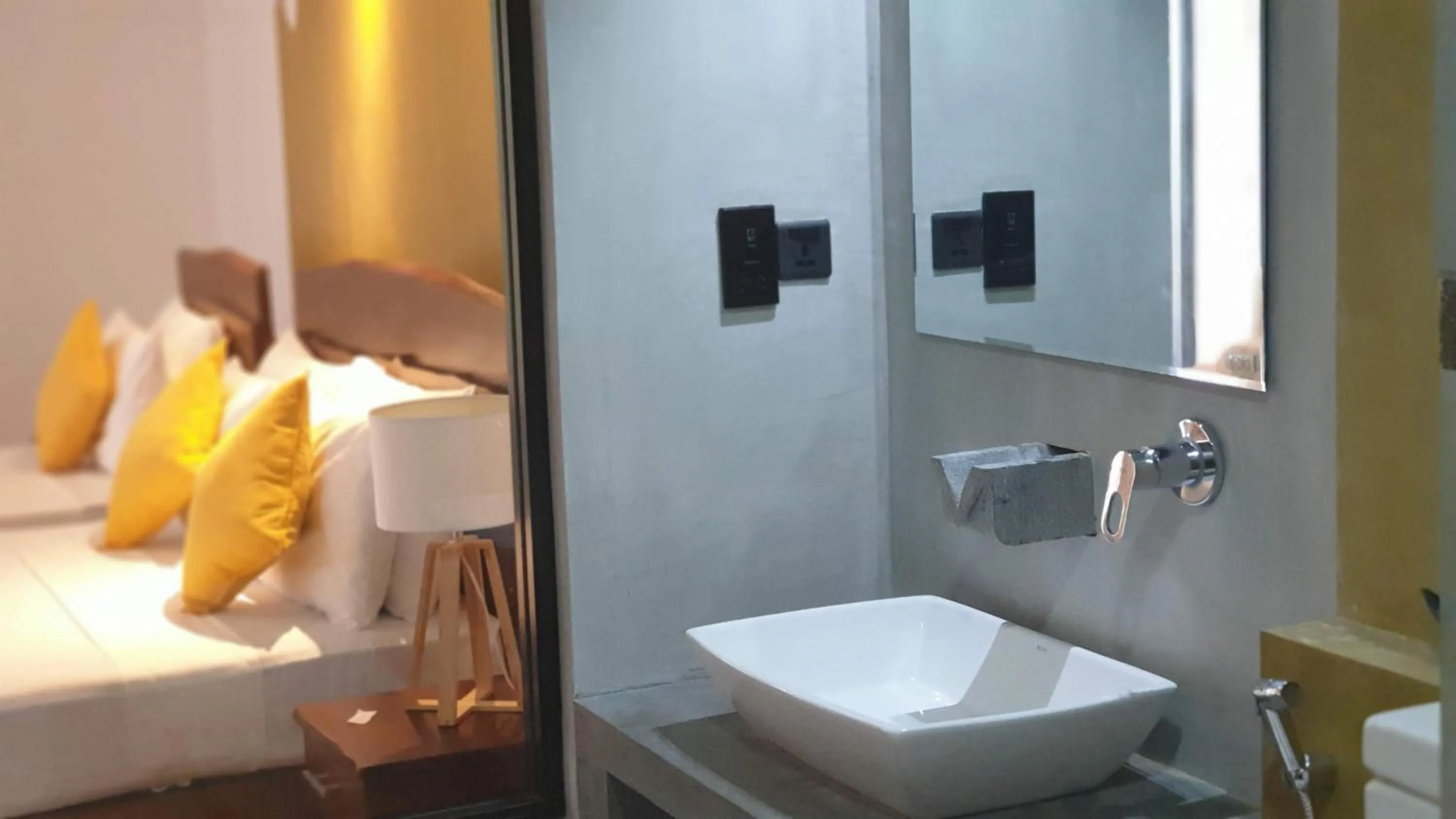 Bed in Royal Tusker Hotel