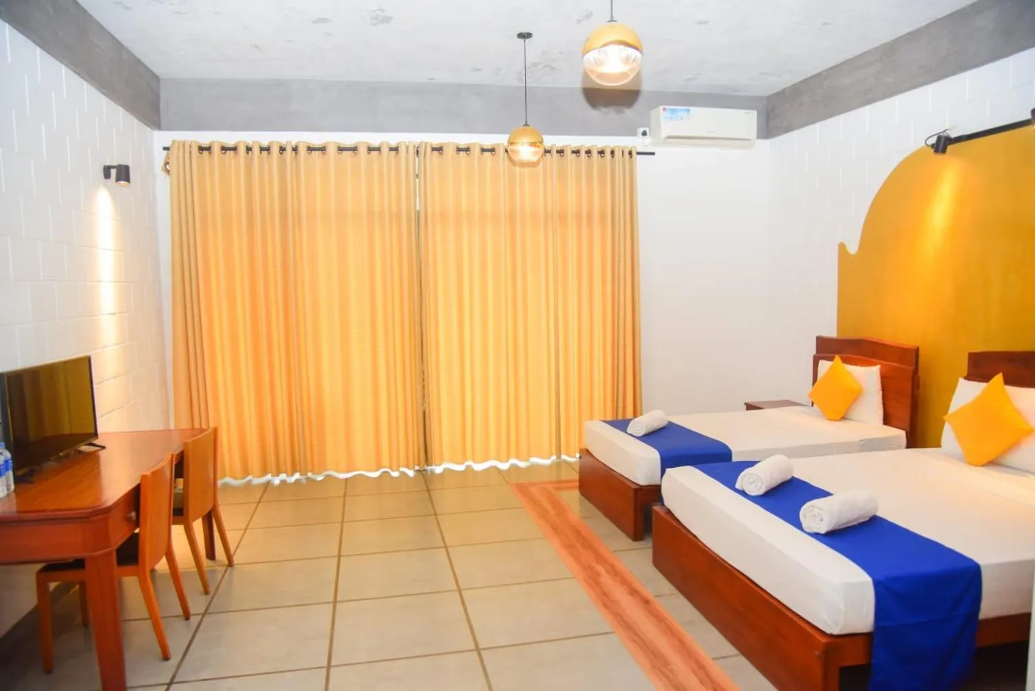 Bed in Royal Tusker Hotel