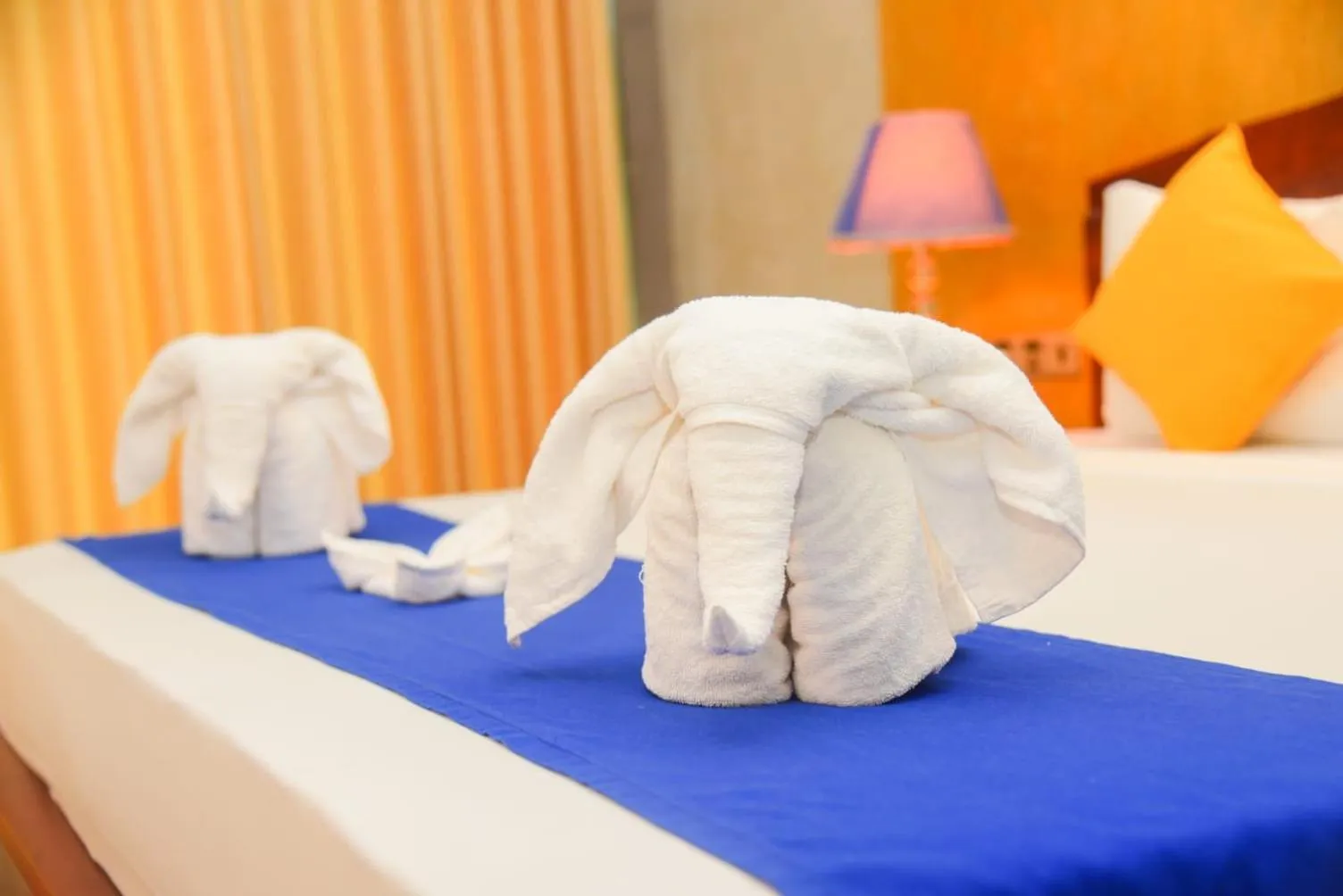 Bed in Royal Tusker Hotel