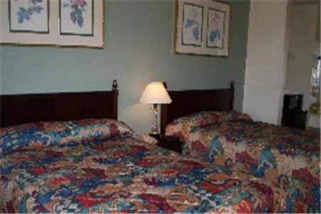 Bed in Somerville Inn and Suites