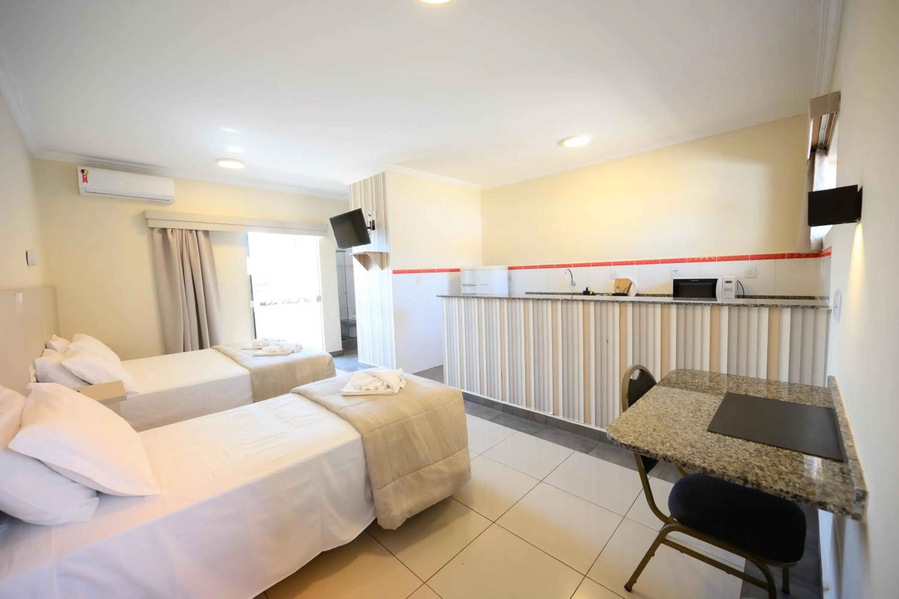 Bed in Colonial Flat Hotel