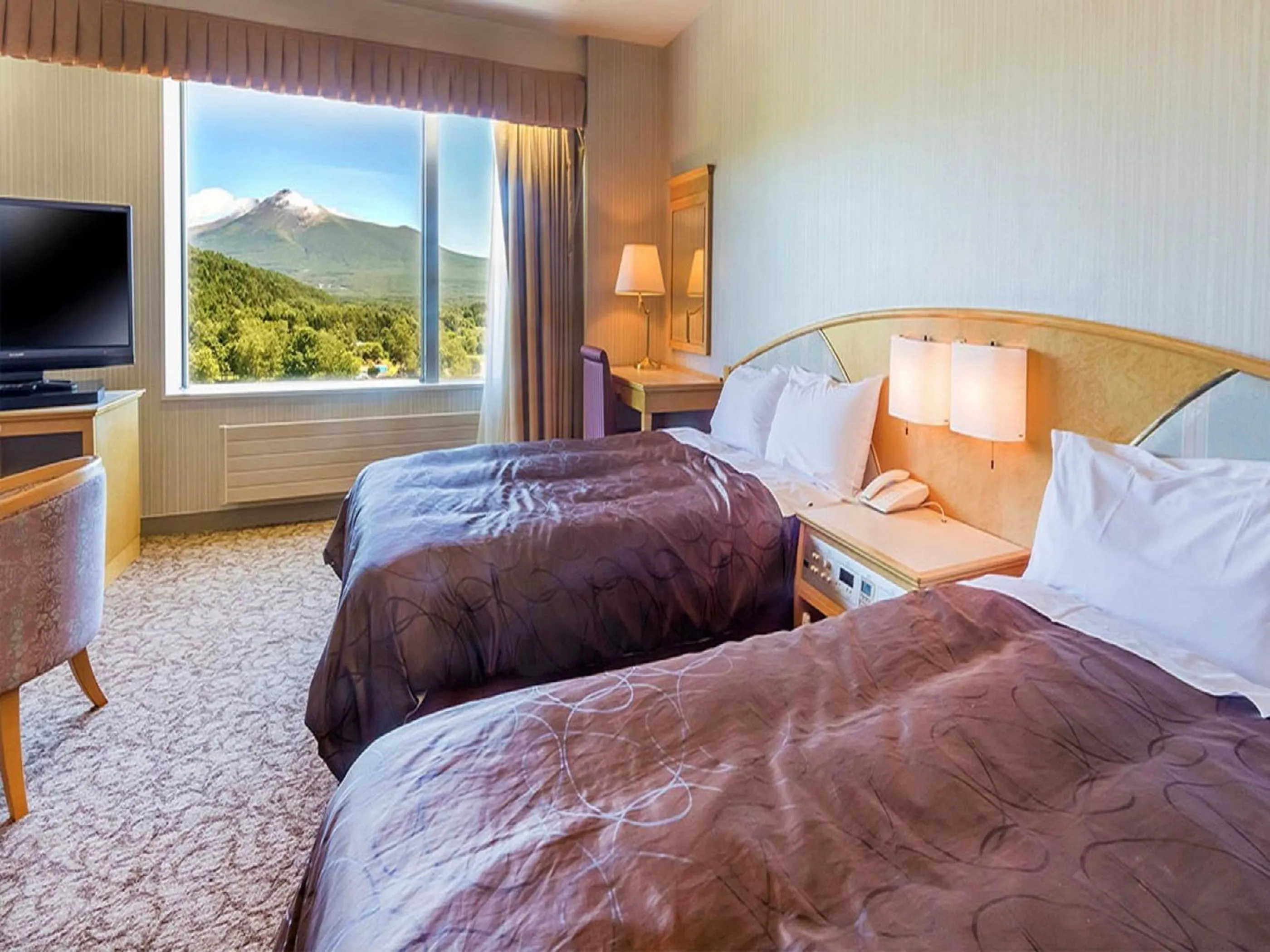 Bed in LiVEMAX RESORT Hakodate Greenpia Onuma