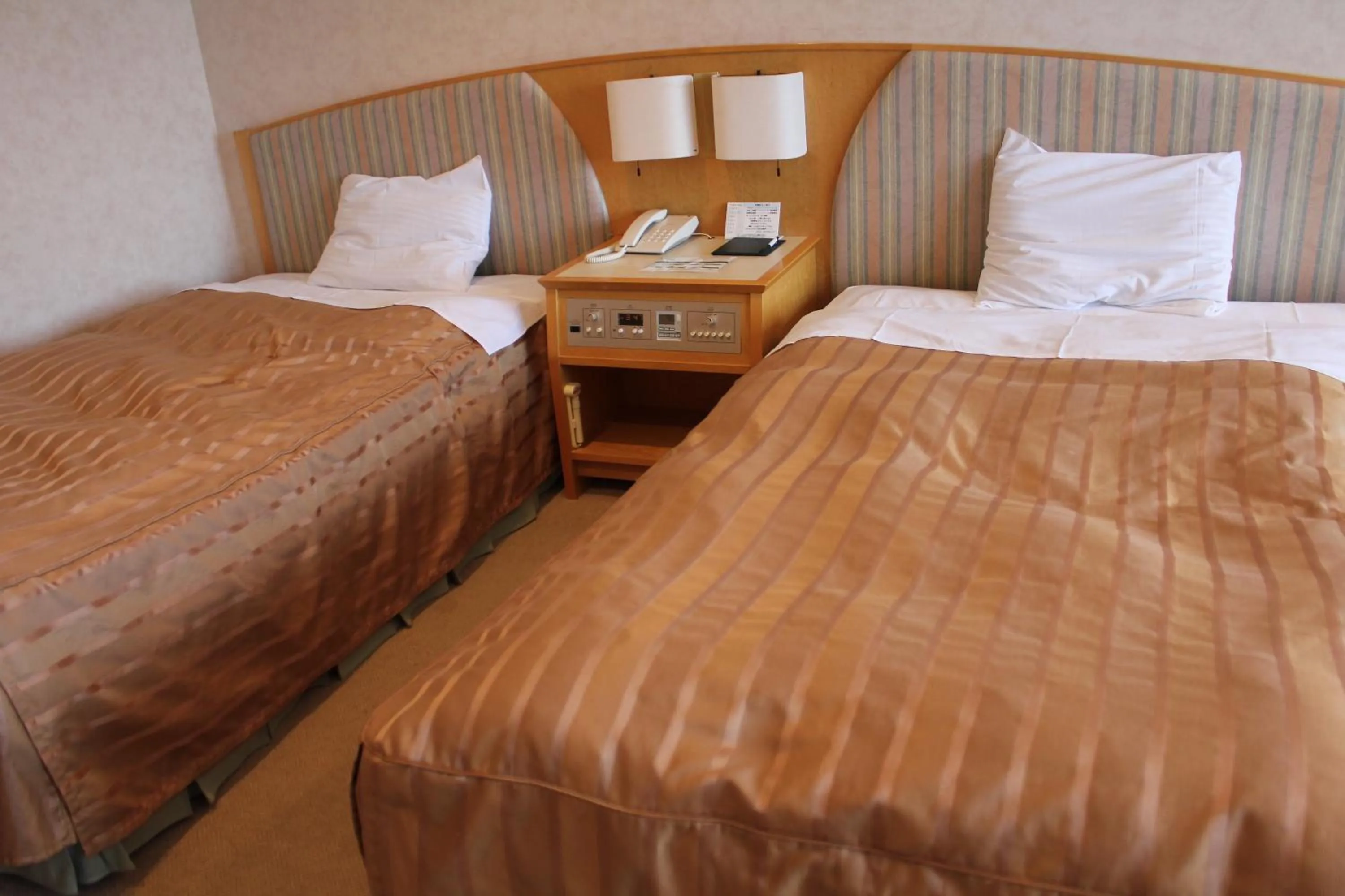 Bed in LiVEMAX RESORT Hakodate Greenpia Onuma