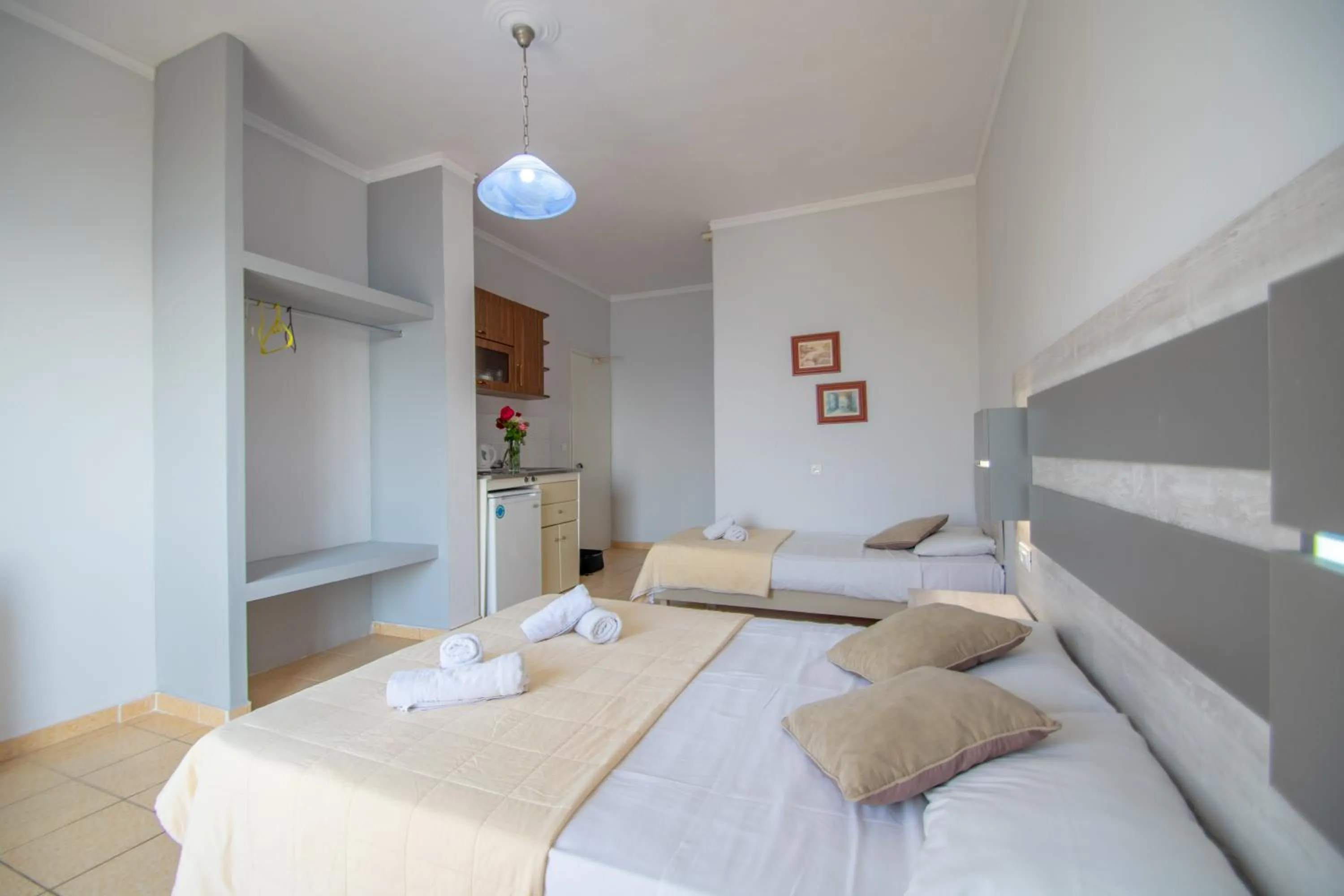 Kitchen or kitchenette, Bed in Agoulos Beach Hotel