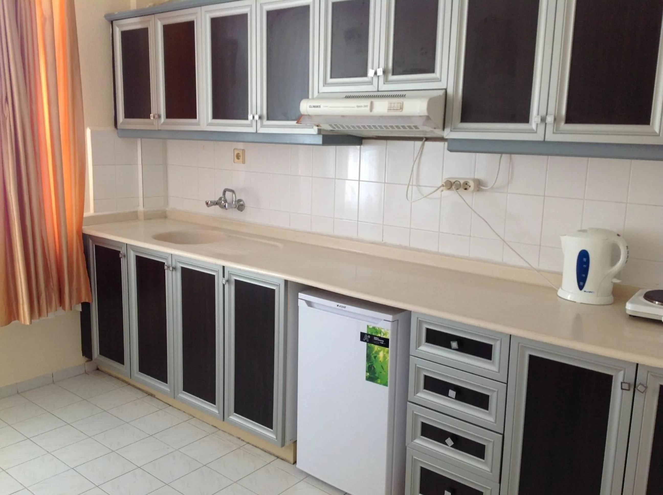 Kitchen or kitchenette in Baronessa Apart Hotel