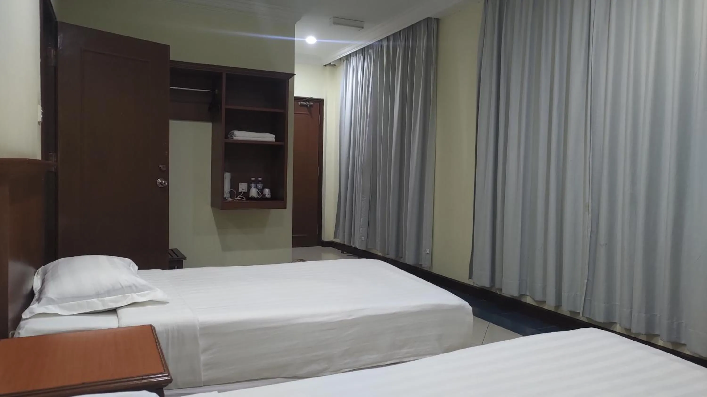 Bed in The Upper Deck Hotel