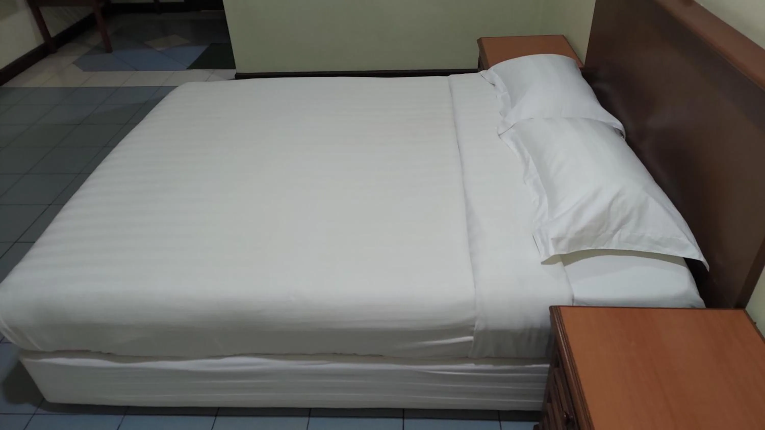 Bed in The Upper Deck Hotel