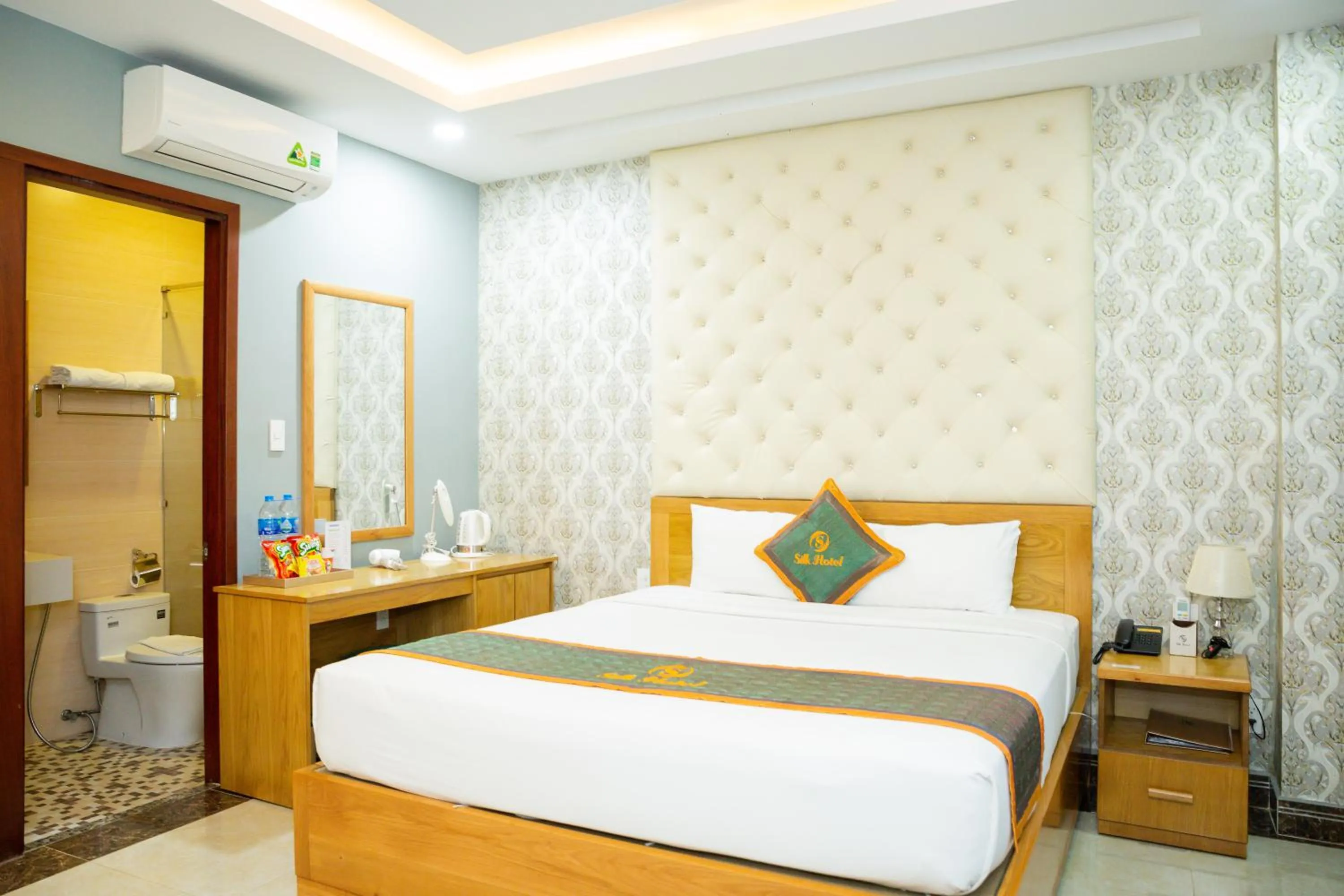 Photo of the whole room, Bed in Silk Hotel near Tan Son Nhat Airport