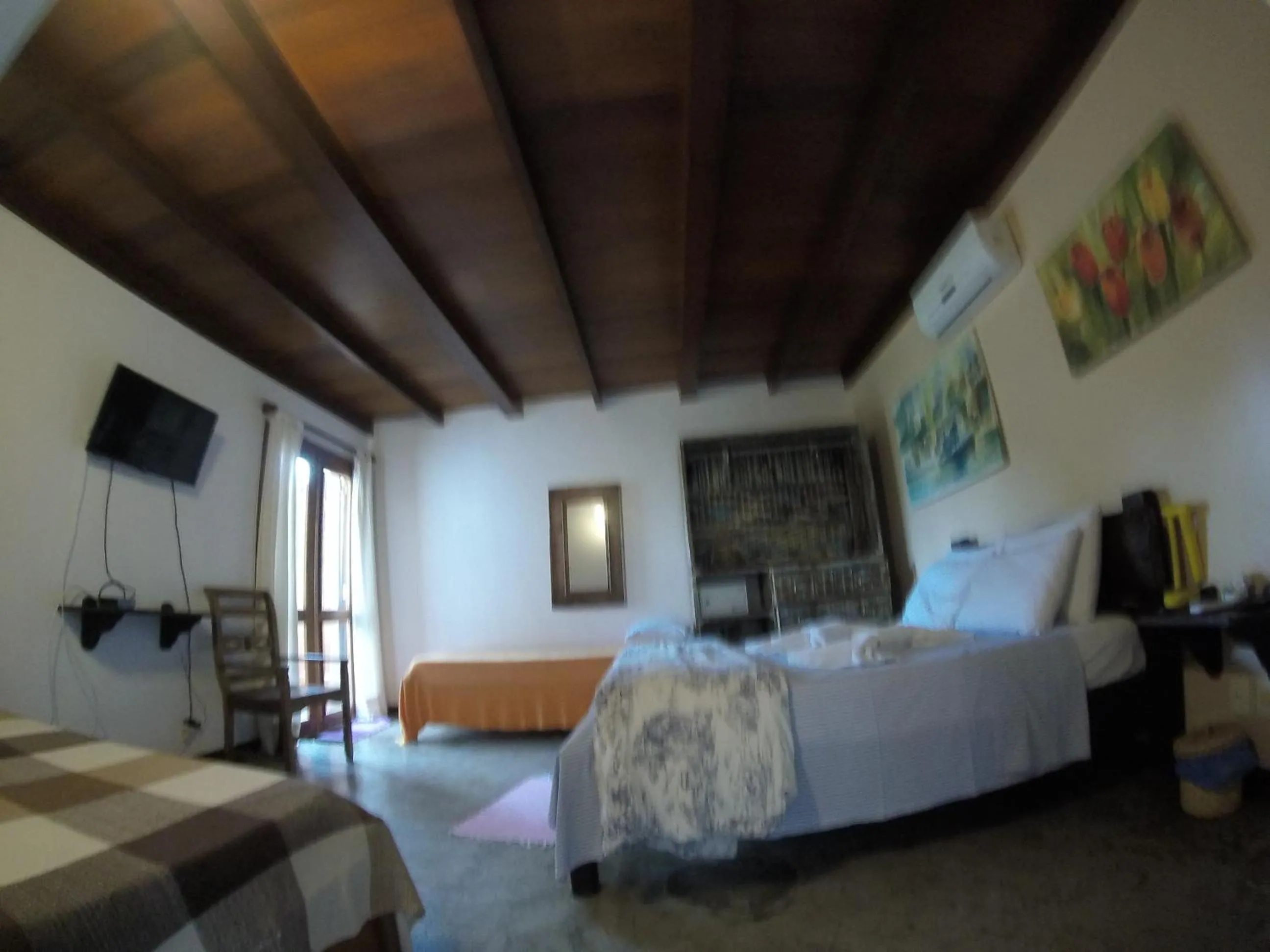 Photo of the whole room, Bed in Pousada Casa das Rosas