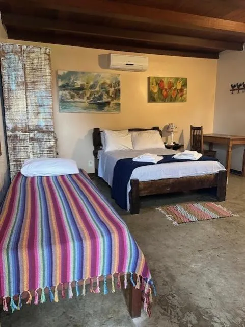 Photo of the whole room, Bed in Pousada Casa das Rosas