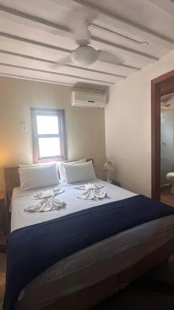 Photo of the whole room, Bed in Pousada Casa das Rosas