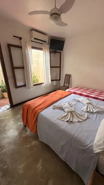 Photo of the whole room, Bed in Pousada Casa das Rosas