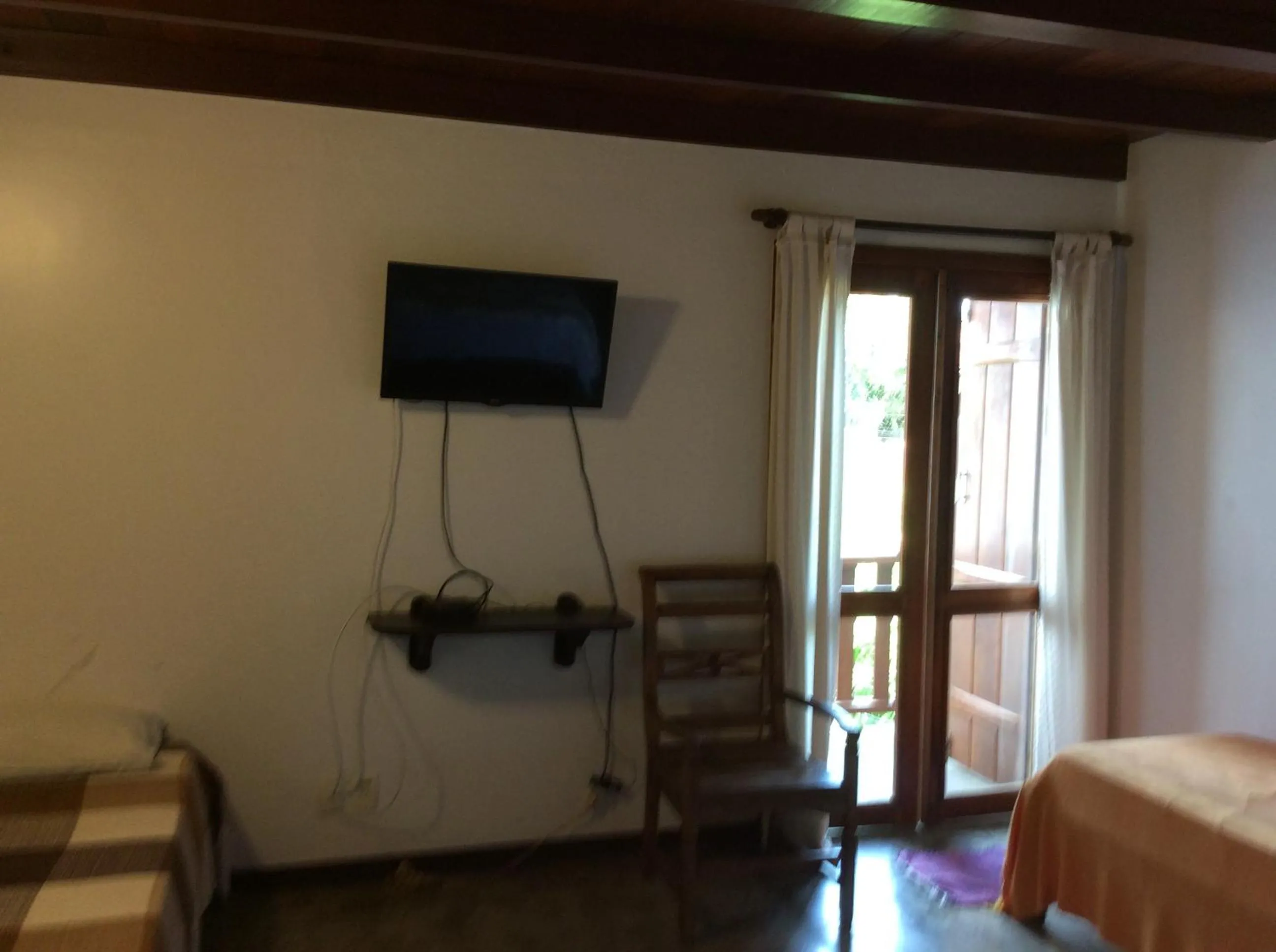 Photo of the whole room, Bed in Pousada Casa das Rosas
