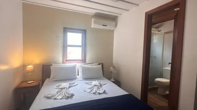 Bed in Pousada Casa das Rosas