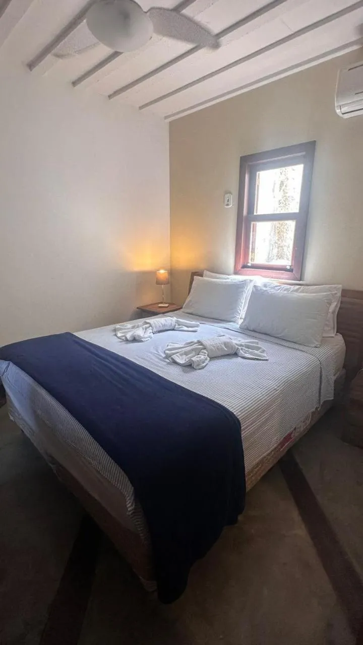 Photo of the whole room, Bed in Pousada Casa das Rosas