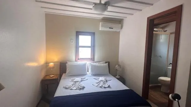 Bed in Pousada Casa das Rosas