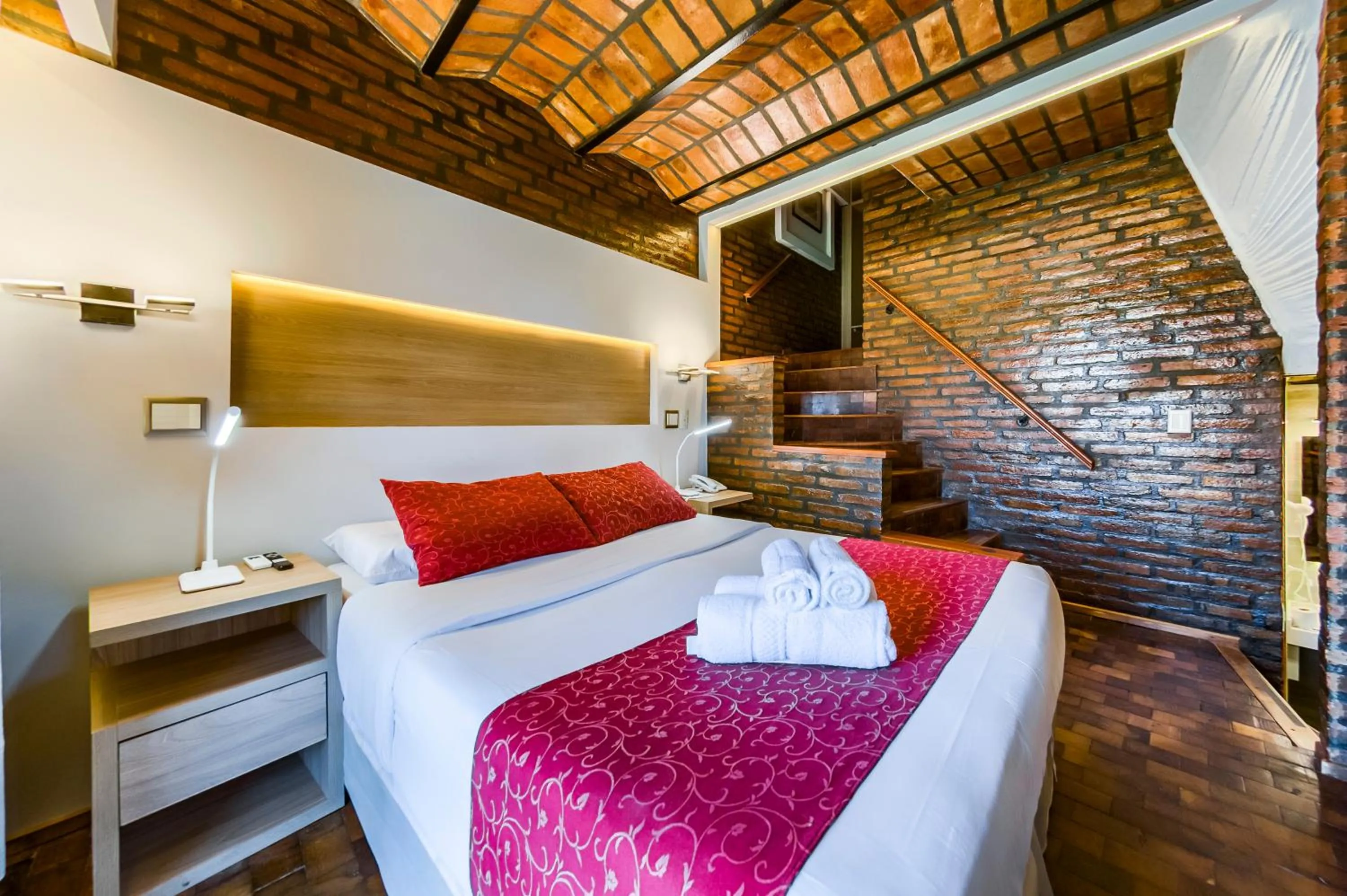 Bed in Portal del Lago Hotel