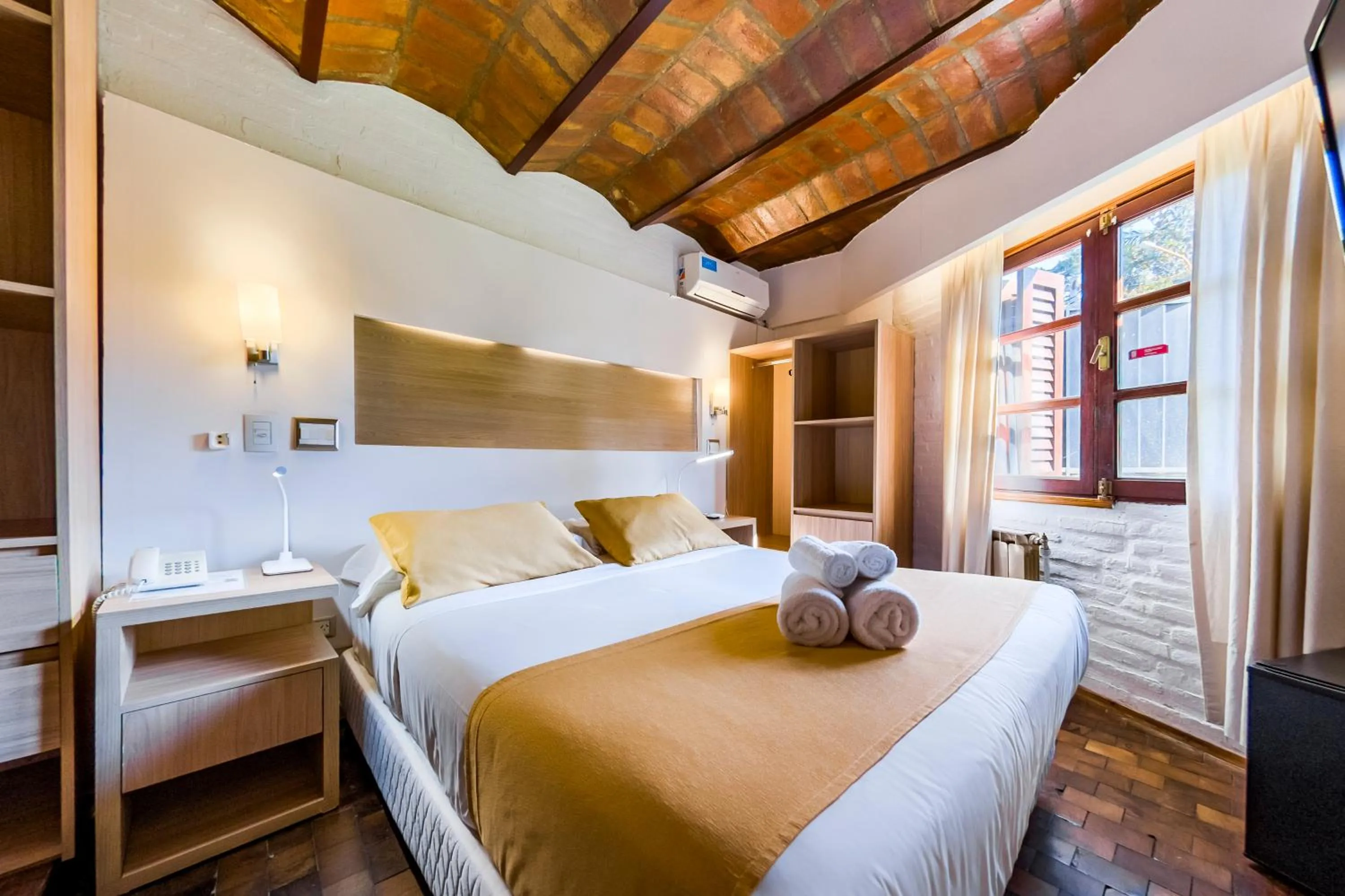 Bed in Portal del Lago Hotel