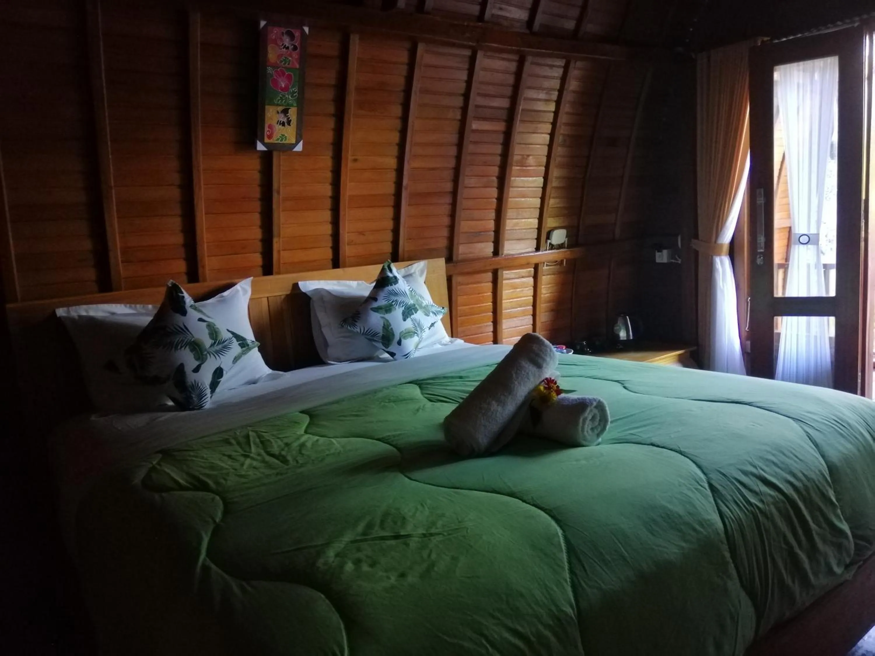 Bed in Ginanthi Cottage