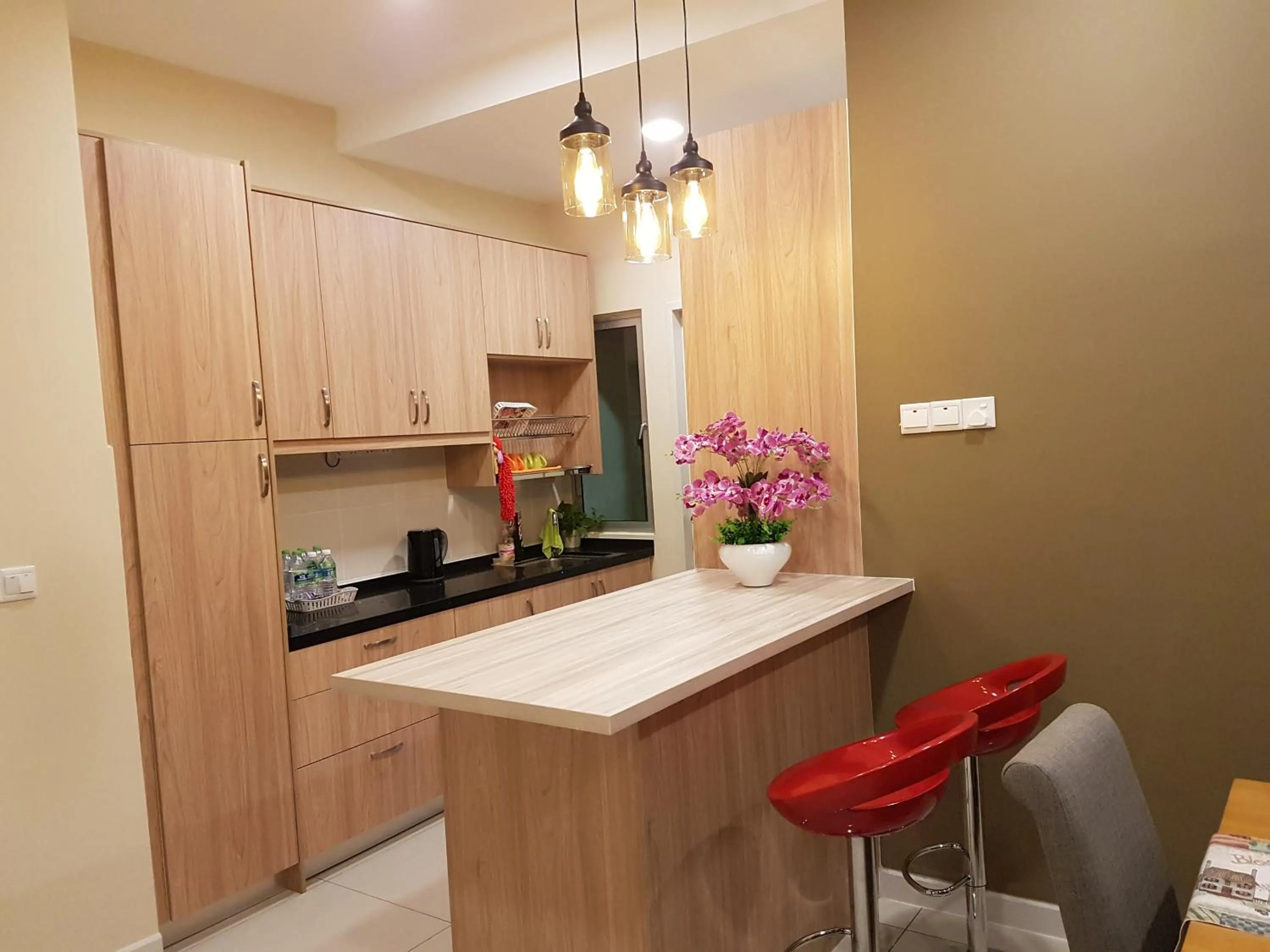 Kitchen or kitchenette in Southville Stay @ Savanna Executive Suite