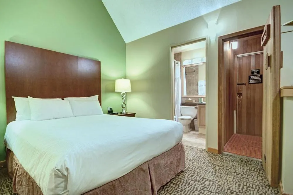 Bed in Mountain Side Hotel Whistler by Executive