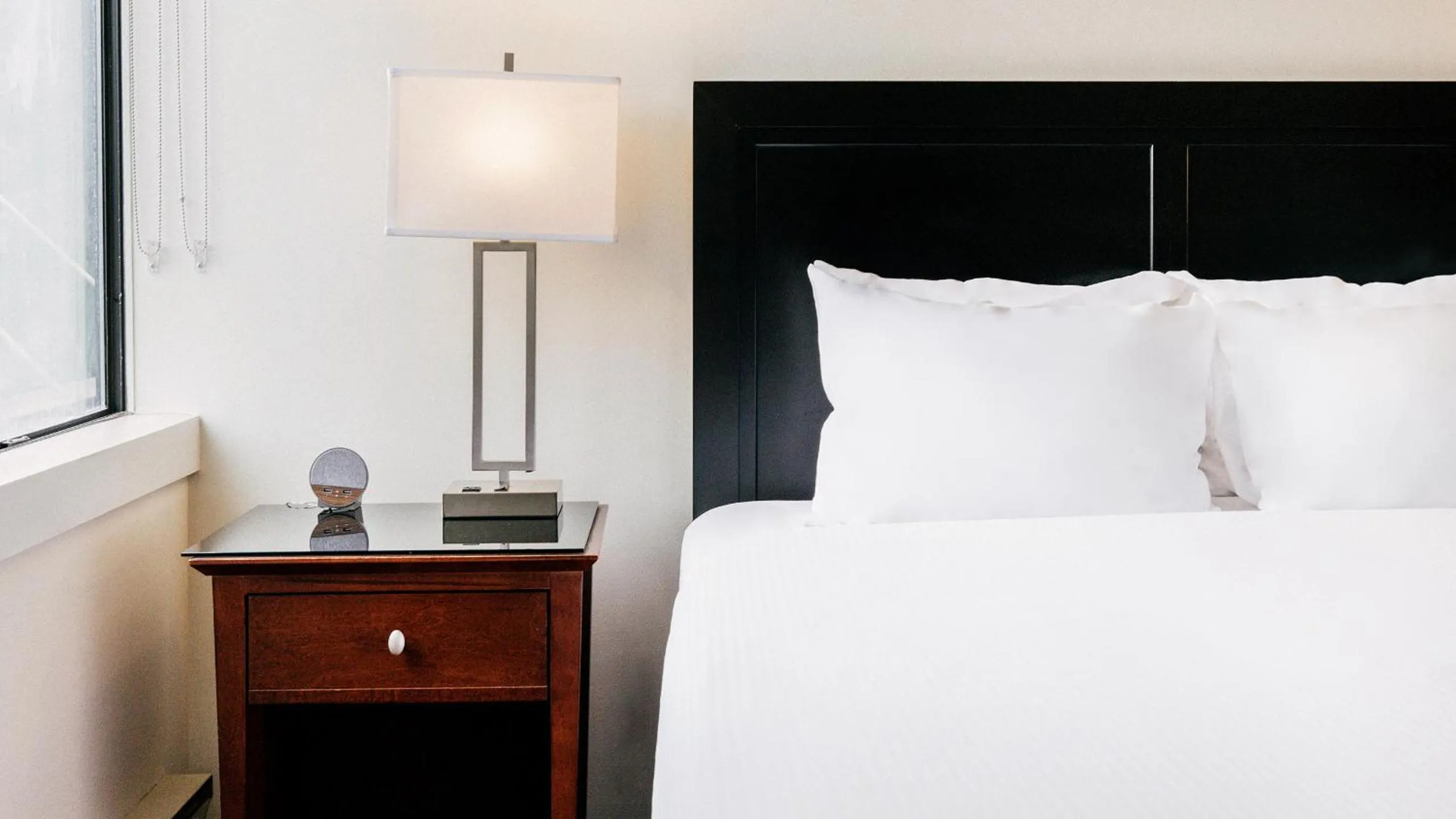 Bed in Mountain Side Hotel Whistler by Executive