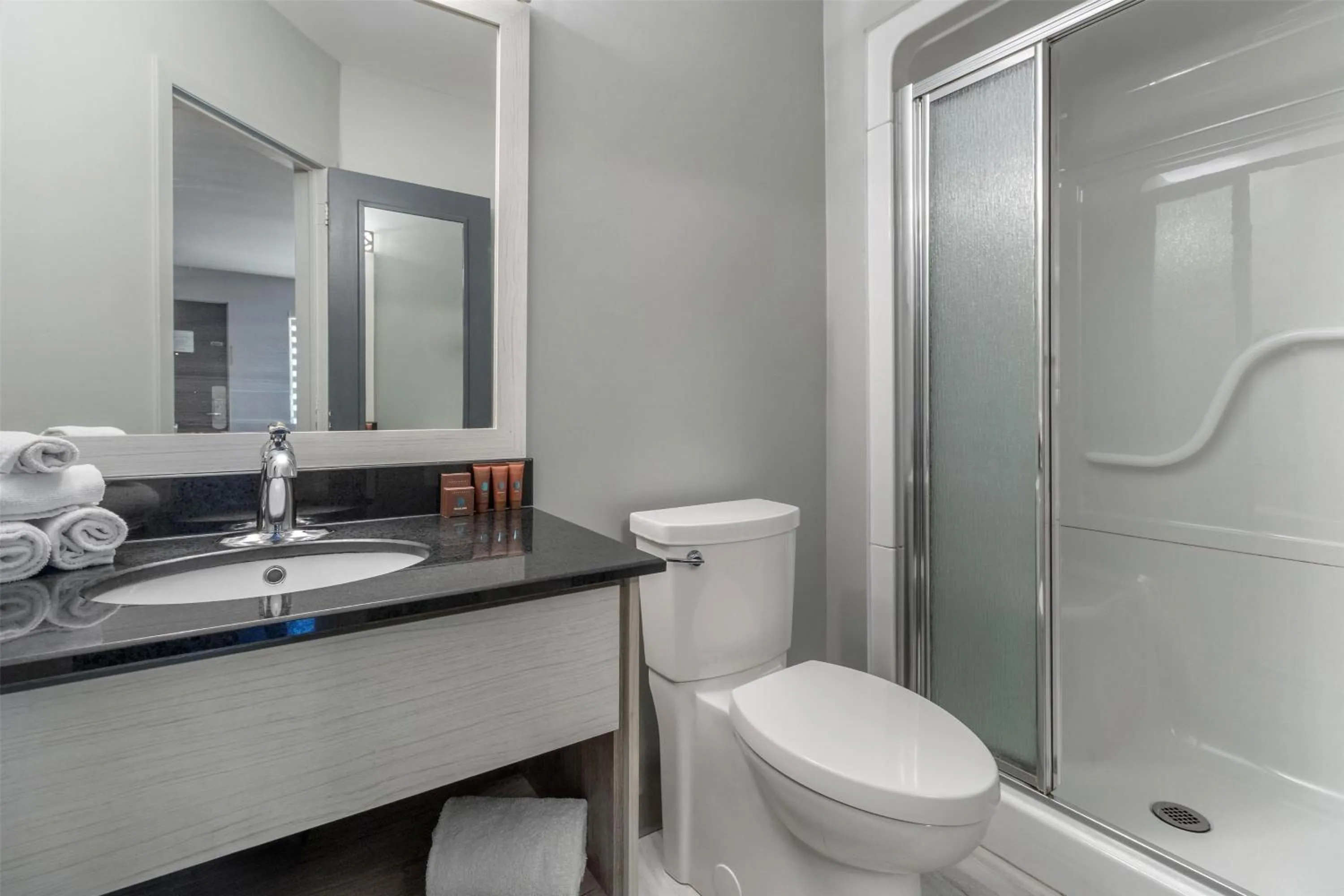 Bathroom in Dannys Suites, SureStay Collection by Best Western
