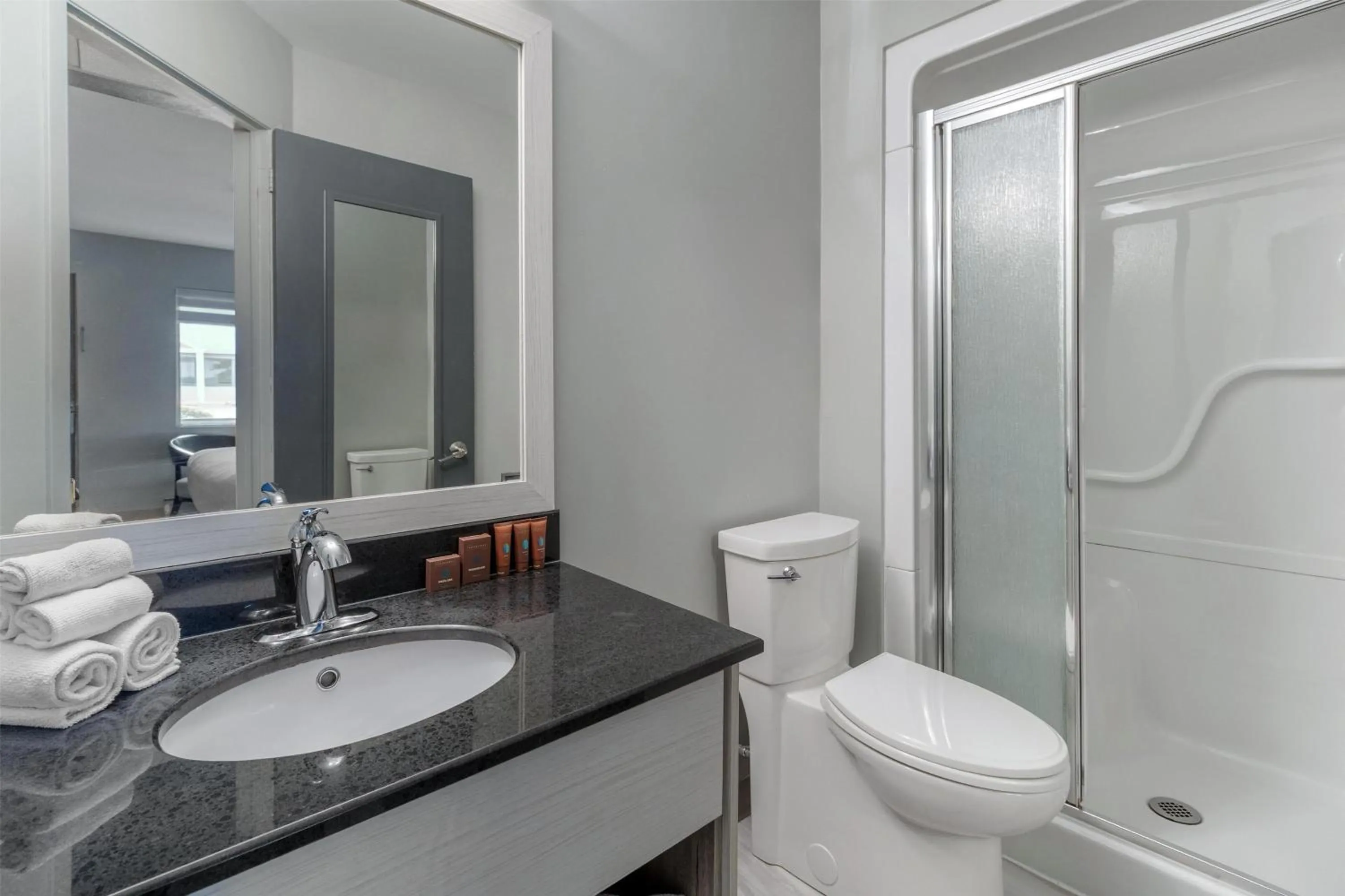 Bathroom in Dannys Suites, SureStay Collection by Best Western