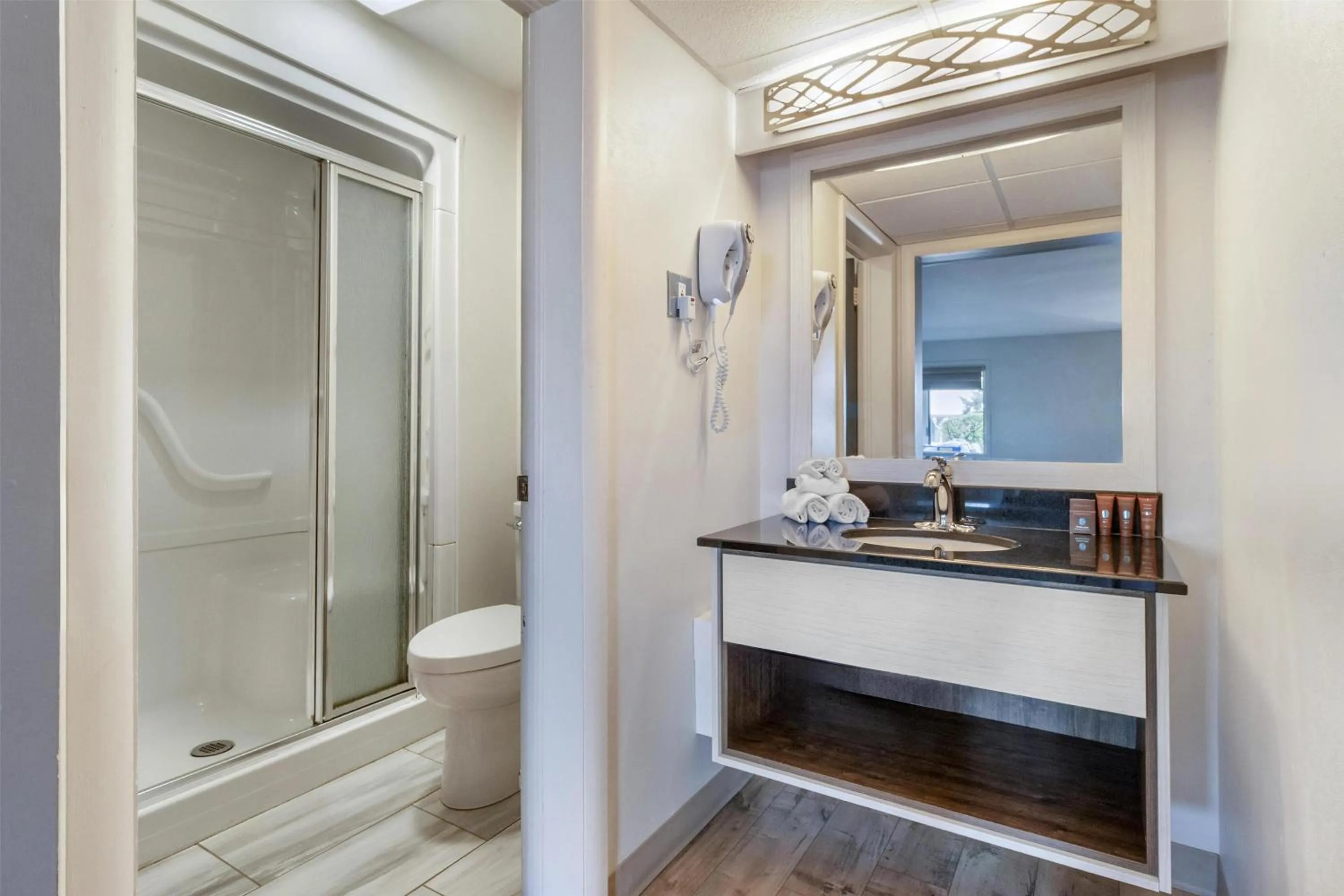 Bathroom in Dannys Suites, SureStay Collection by Best Western