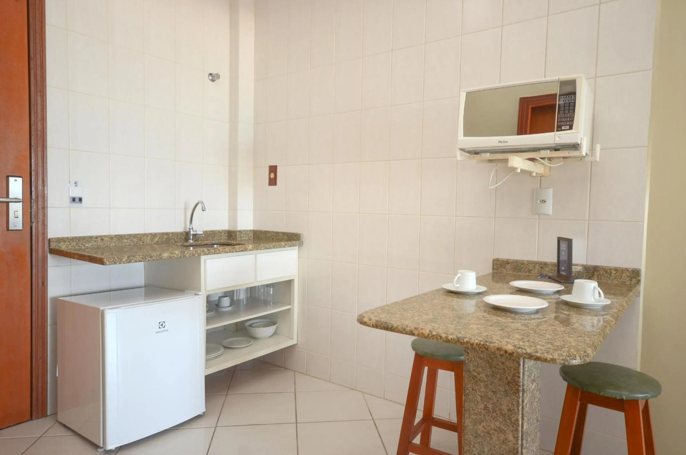 Kitchen or kitchenette in Pousada Garatéia
