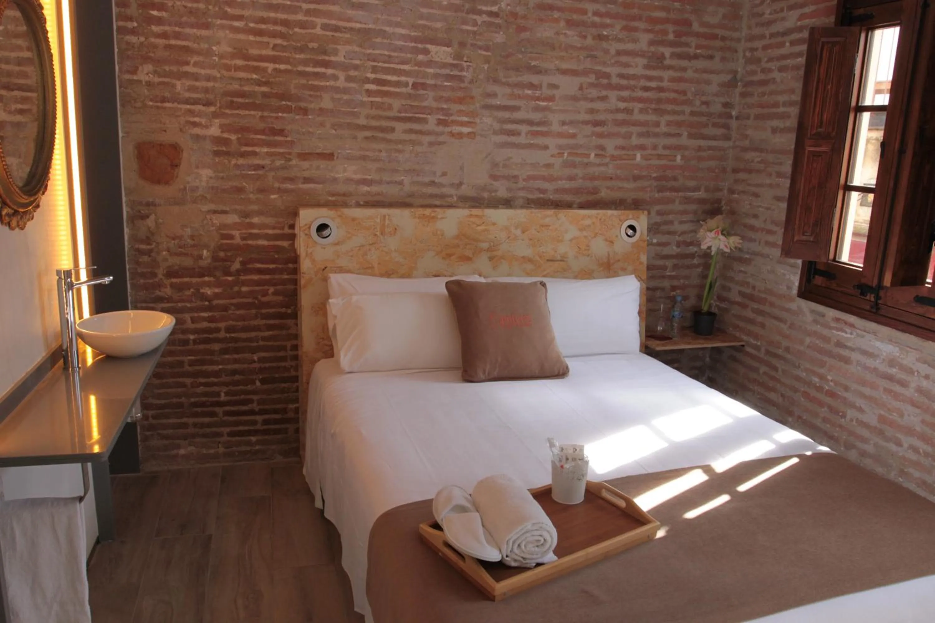 Bed in Àmfores Boutique Guest House