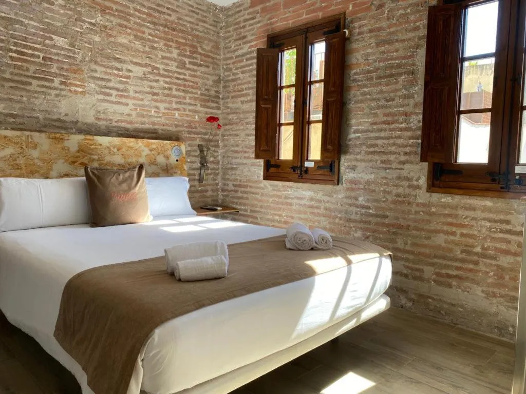 Bed in Àmfores Boutique Guest House