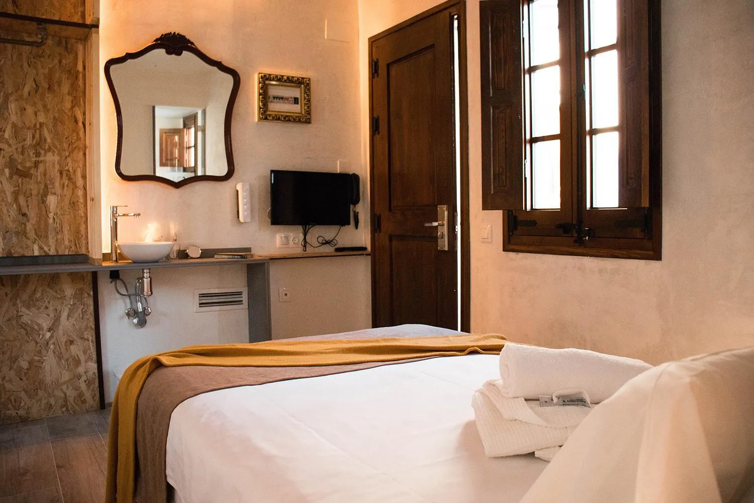 Bed in Àmfores Boutique Guest House