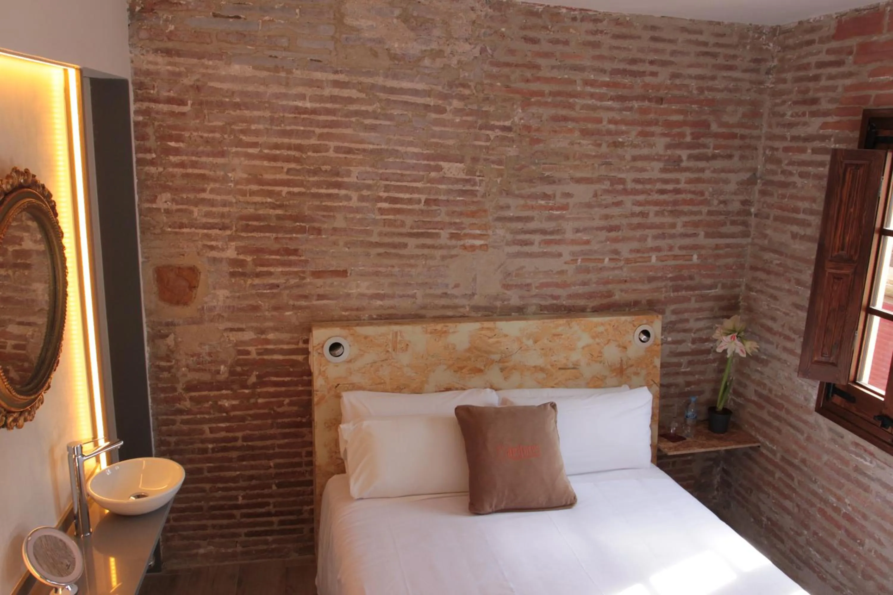 Bed in Àmfores Boutique Guest House