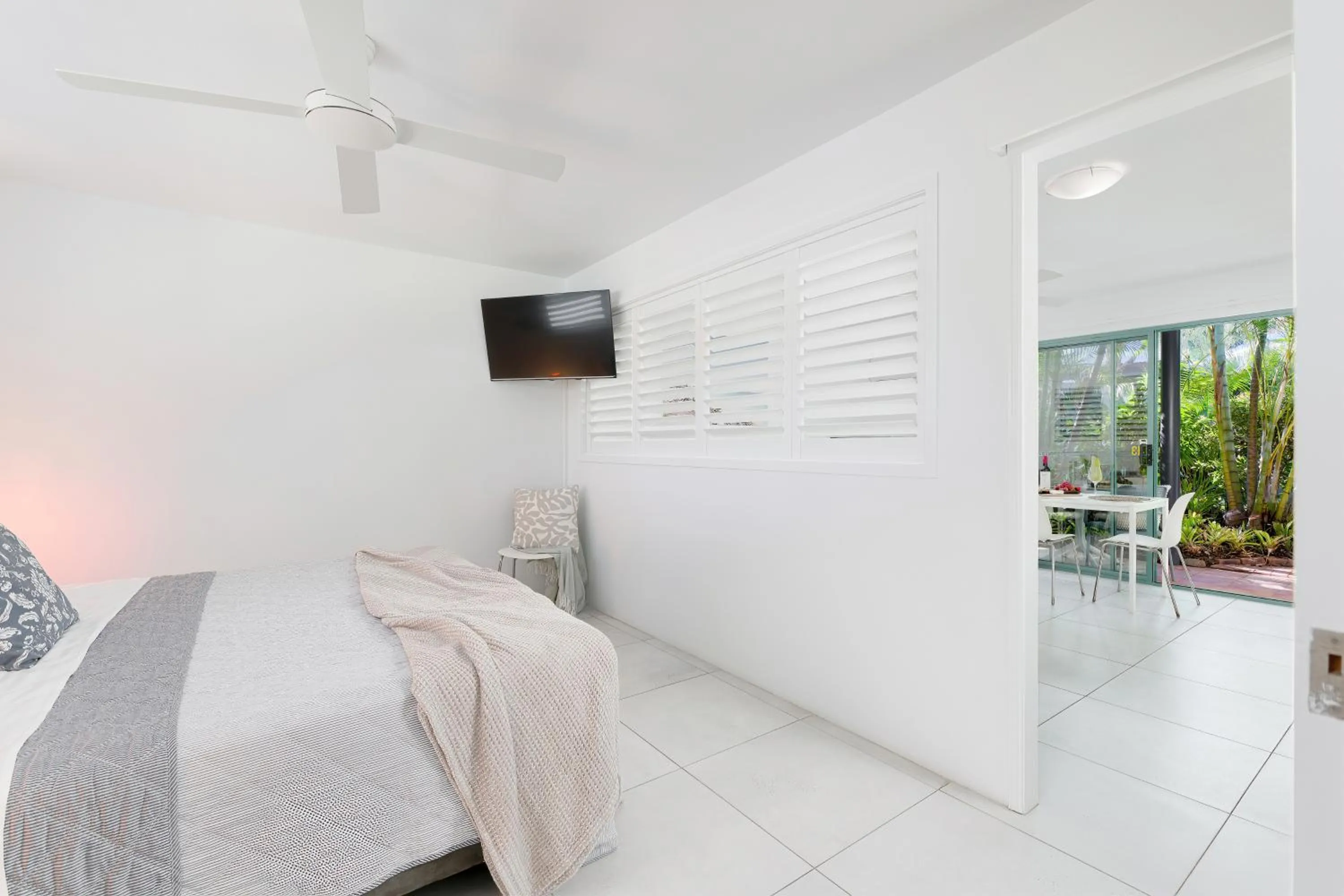 Bed in Chez Noosa Holiday Apartments